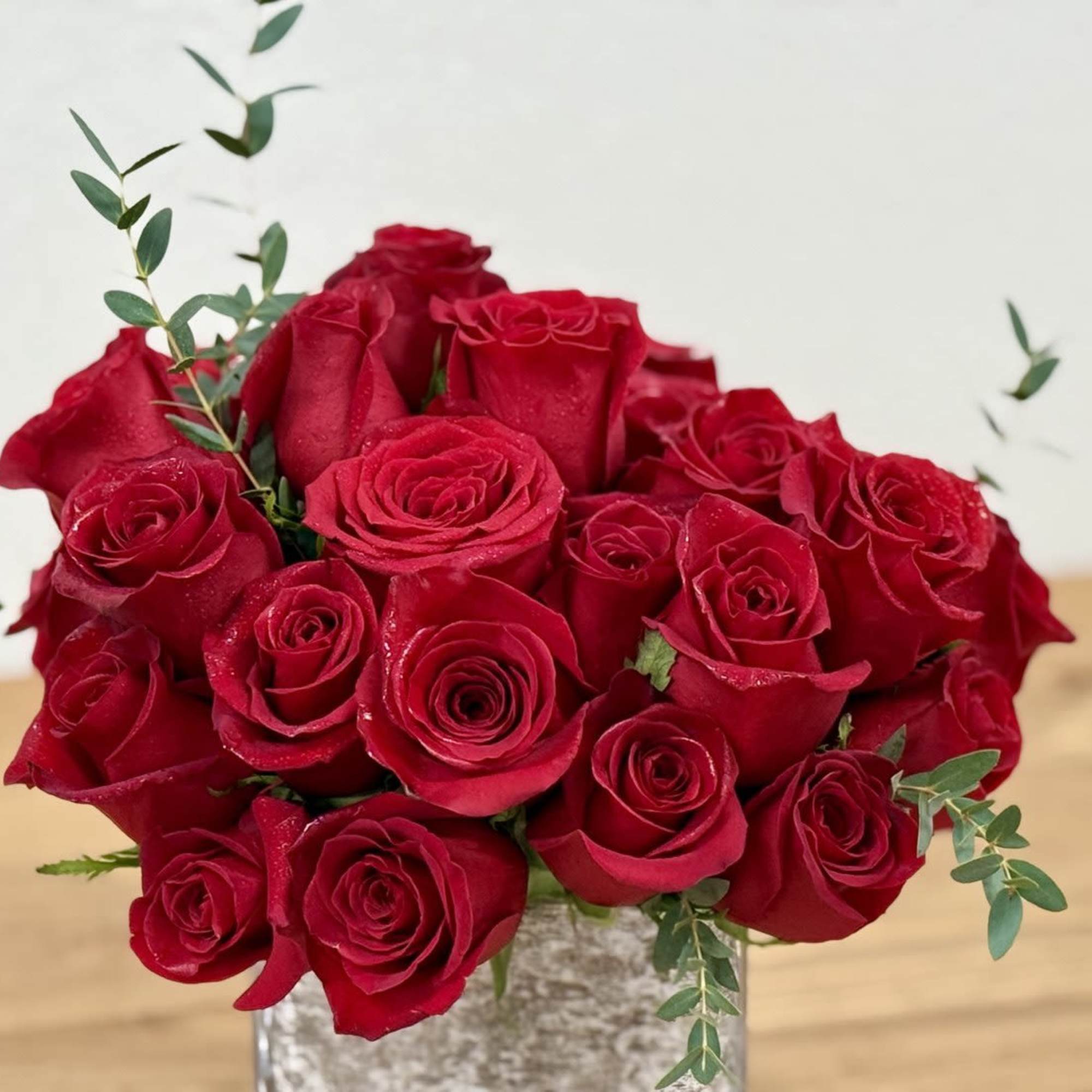 Bouquet of red roses in a clear glass vase