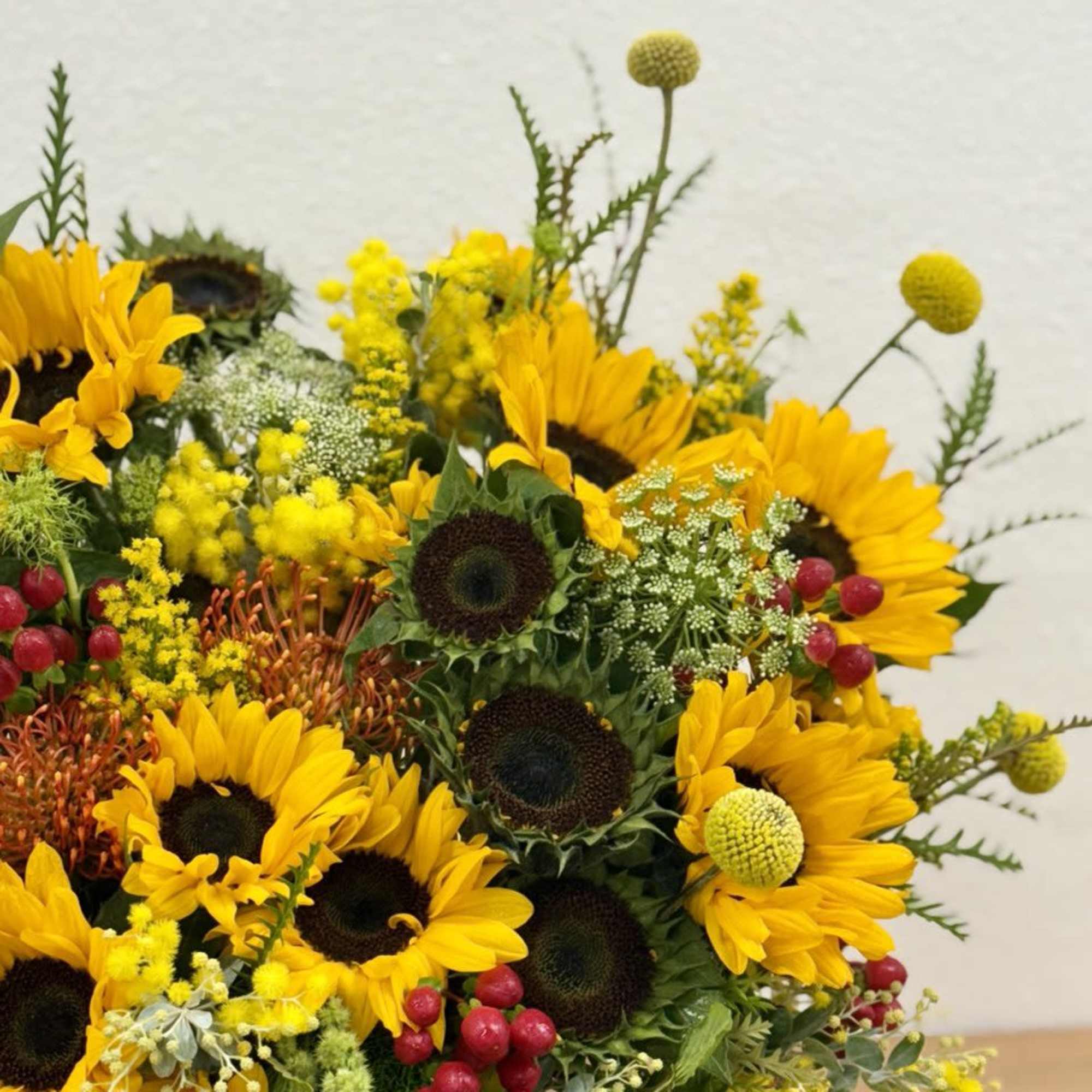 Bouquet of yellow sunflowers with red berries and mixed filler flowers, photo 4 of 4