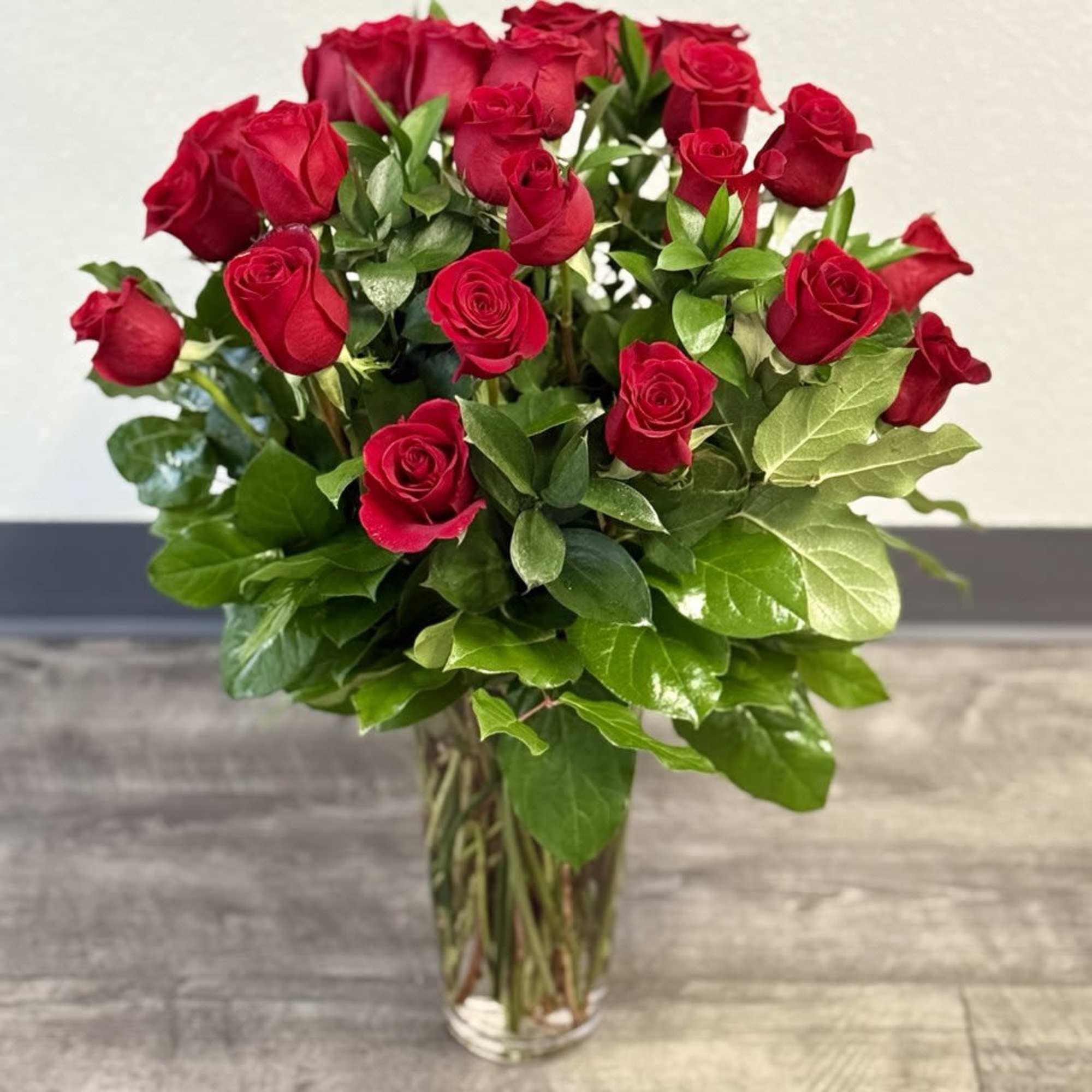 Bouquet of red roses in a clear glass vase