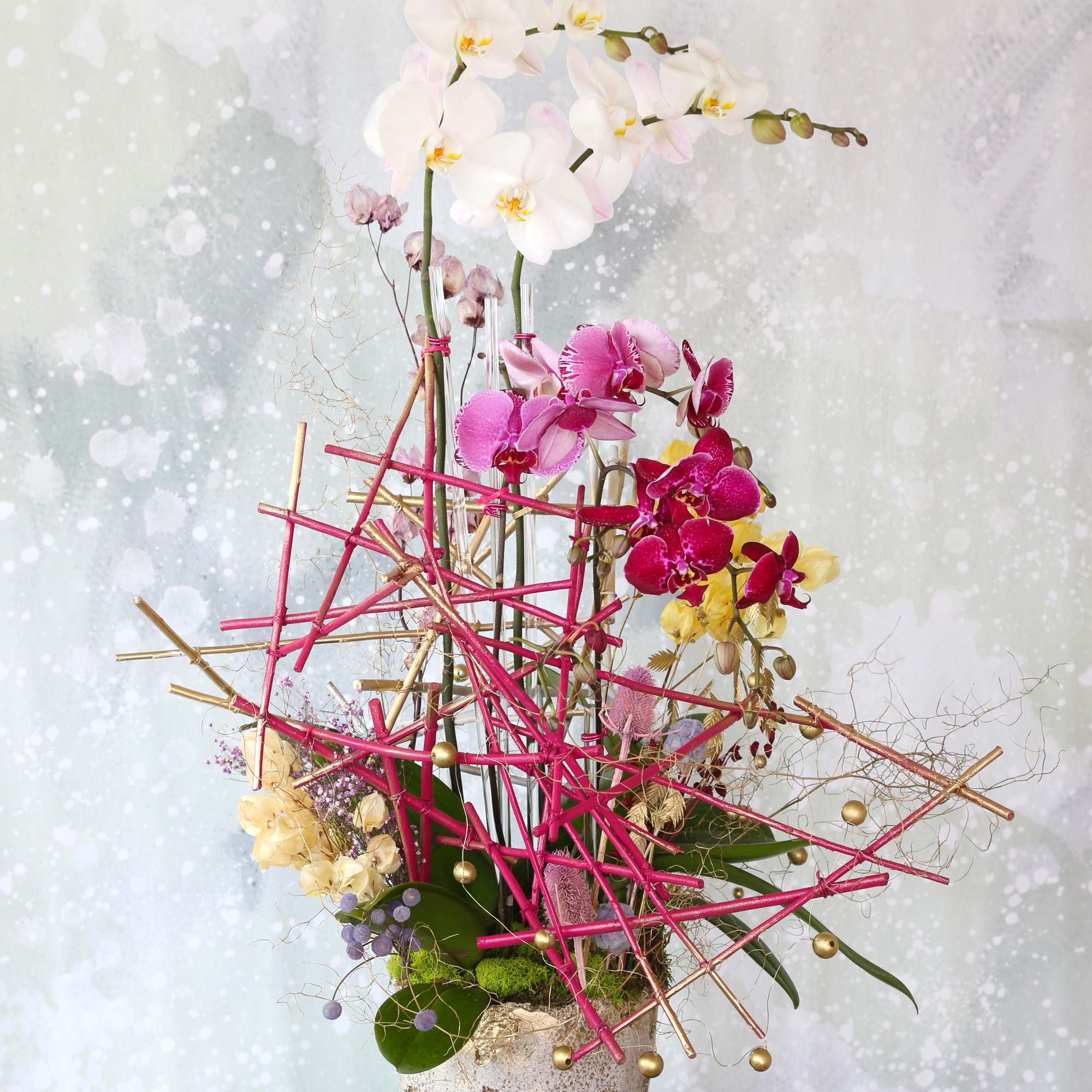 This limited mother's day artful Orchid arrangement featuring large white Phalaenopsis orchids