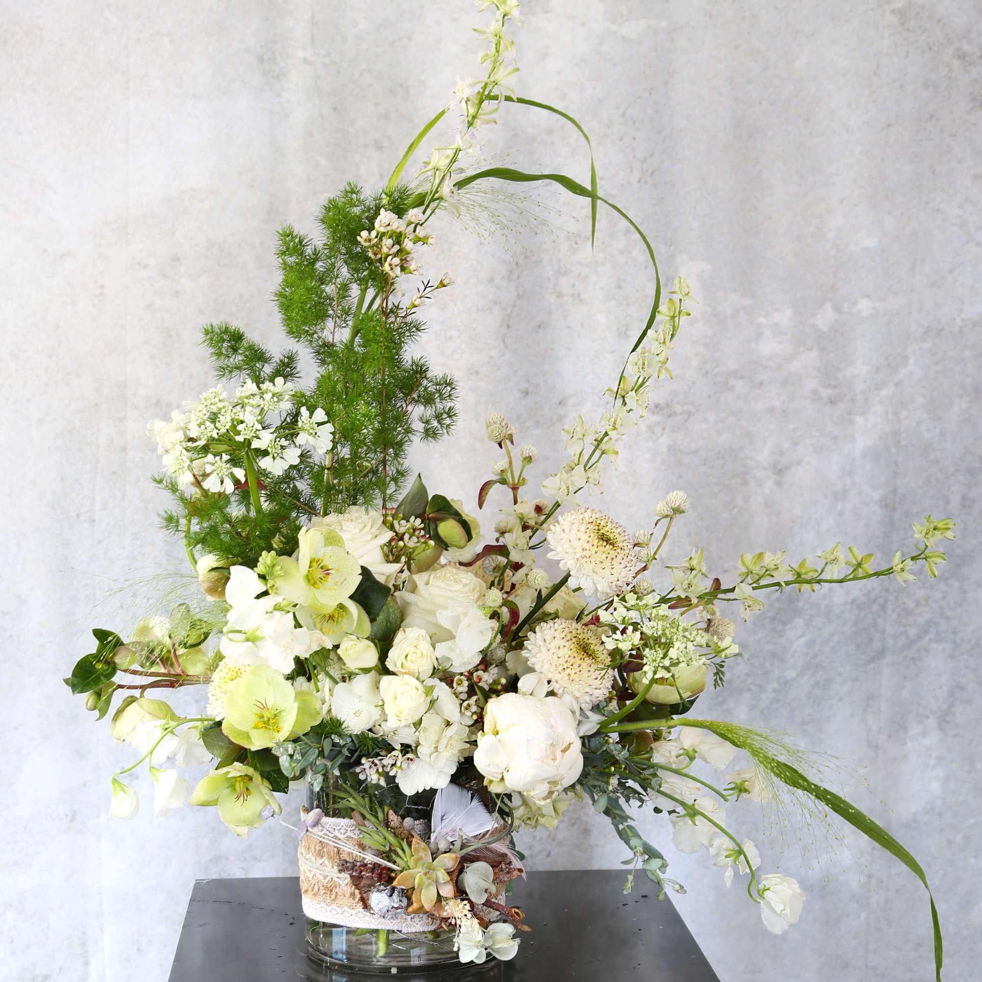An elegant luxury arrangement with all precious ivory bloom, such as garden