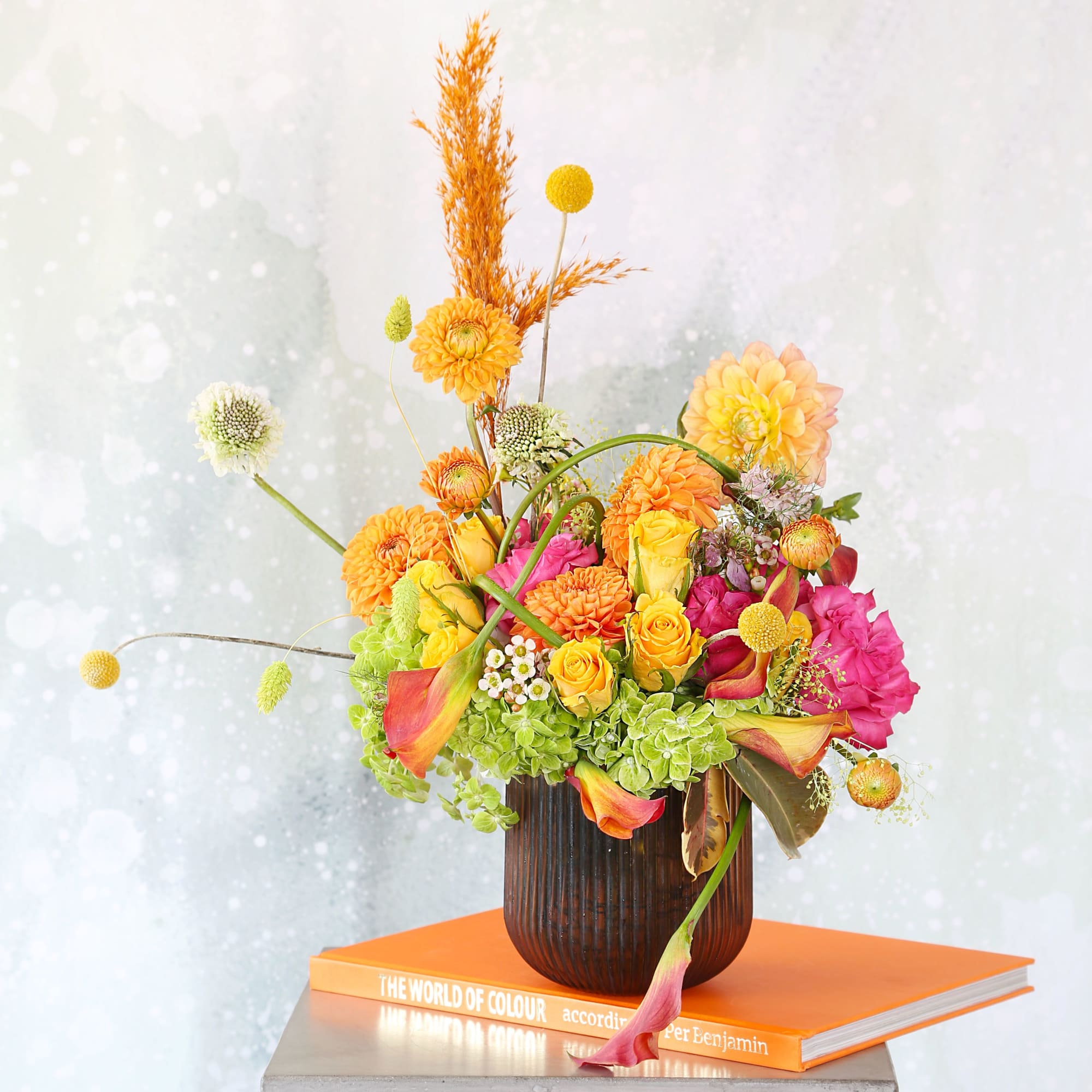 A cheerful orange, fuchsia, yellow green color palette vase arrangement create with, photo 2 of 4