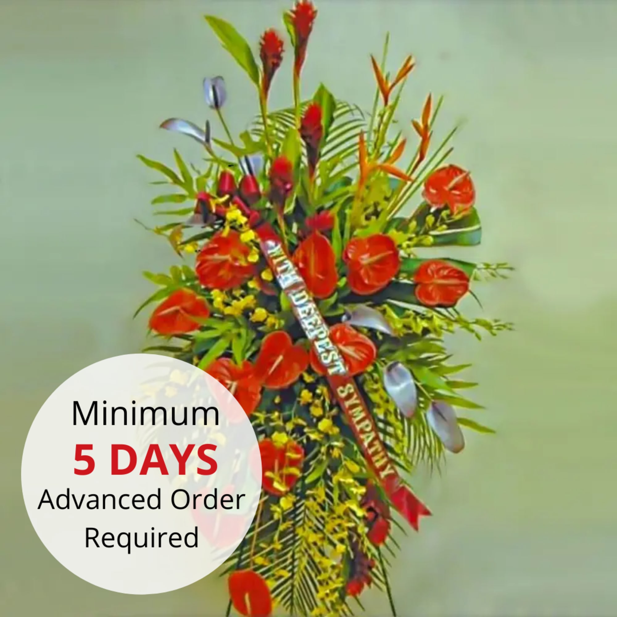 Tall standing sympathy spray with red tropical flowers and a sympathy banner ribbon