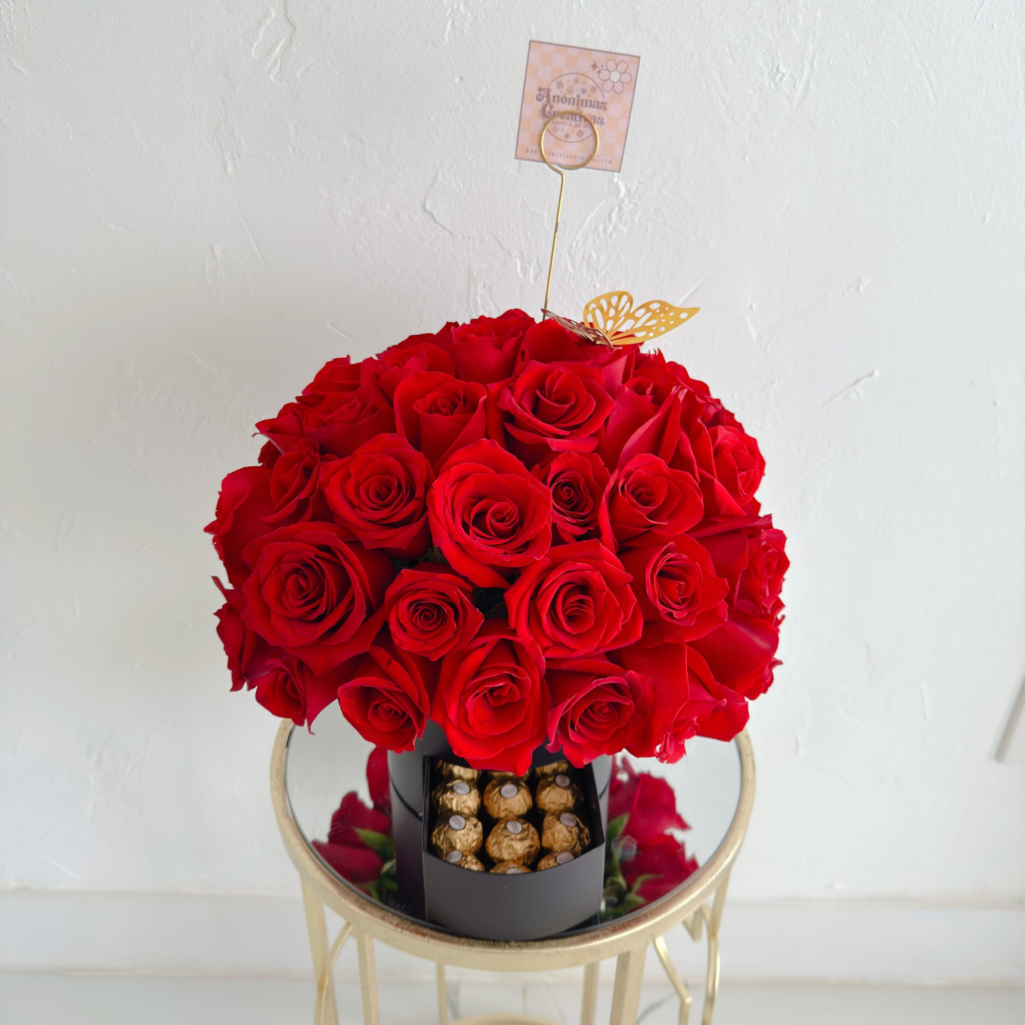 An elegant and captivating arrangement featuring 50 premium red roses, beautifully arranged