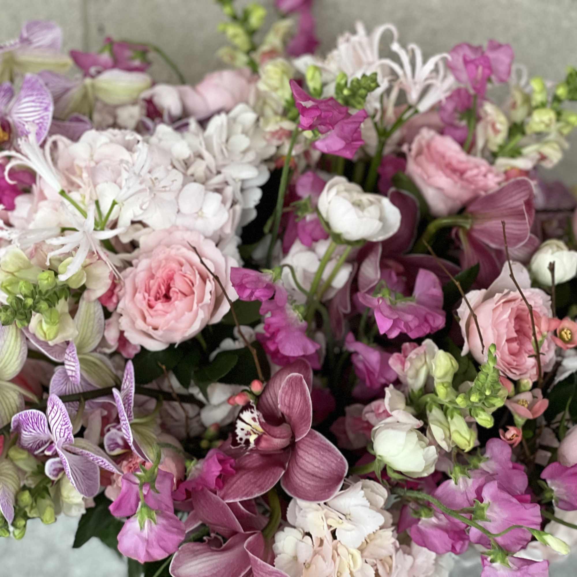 Pink and white mixed bouquet with orchids and roses