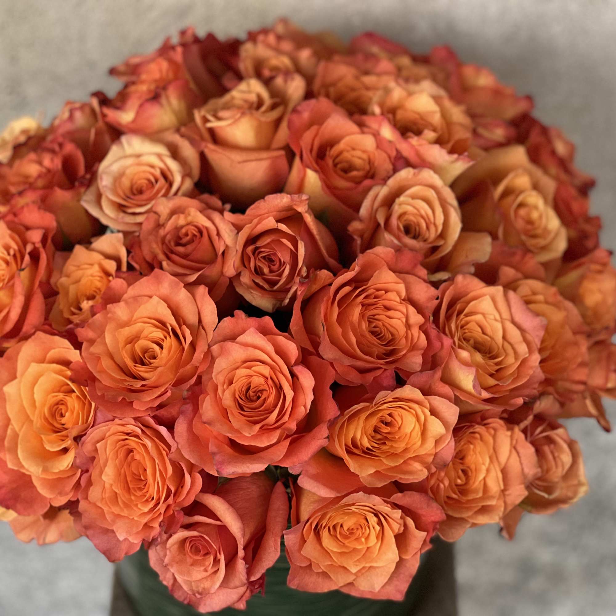 Bouquet of orange roses in a vase