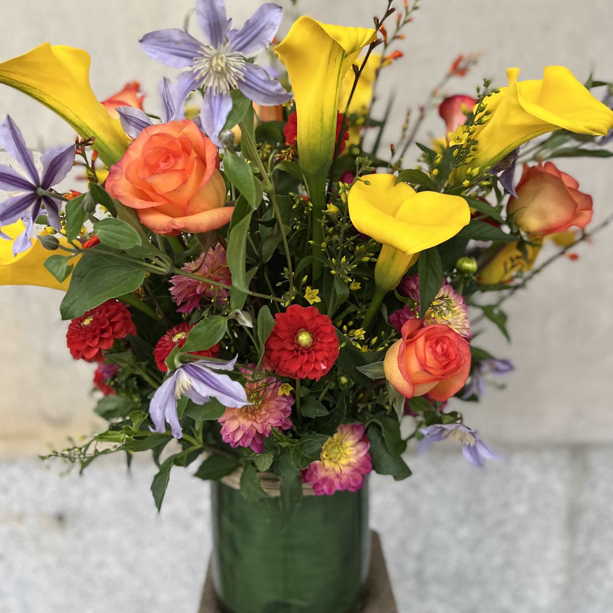 Medium to tall composition assortment of yellow captain calla lily's, yellow lysimachia, photo 2 of 10