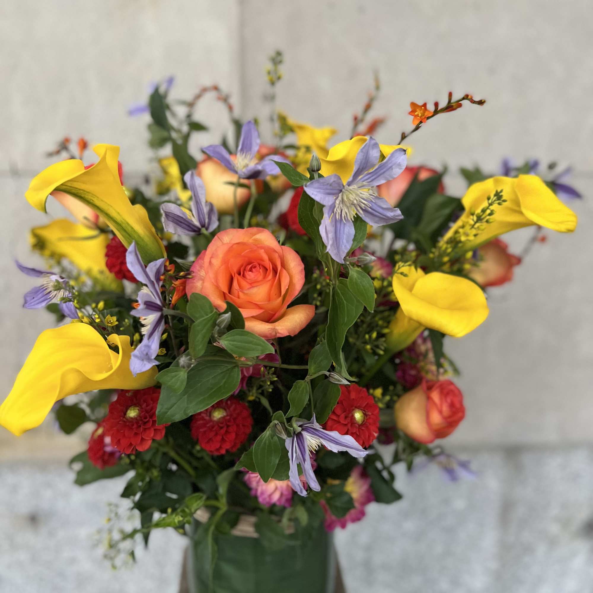 Medium to tall composition assortment of yellow captain calla lily's, yellow lysimachia, photo 7 of 10