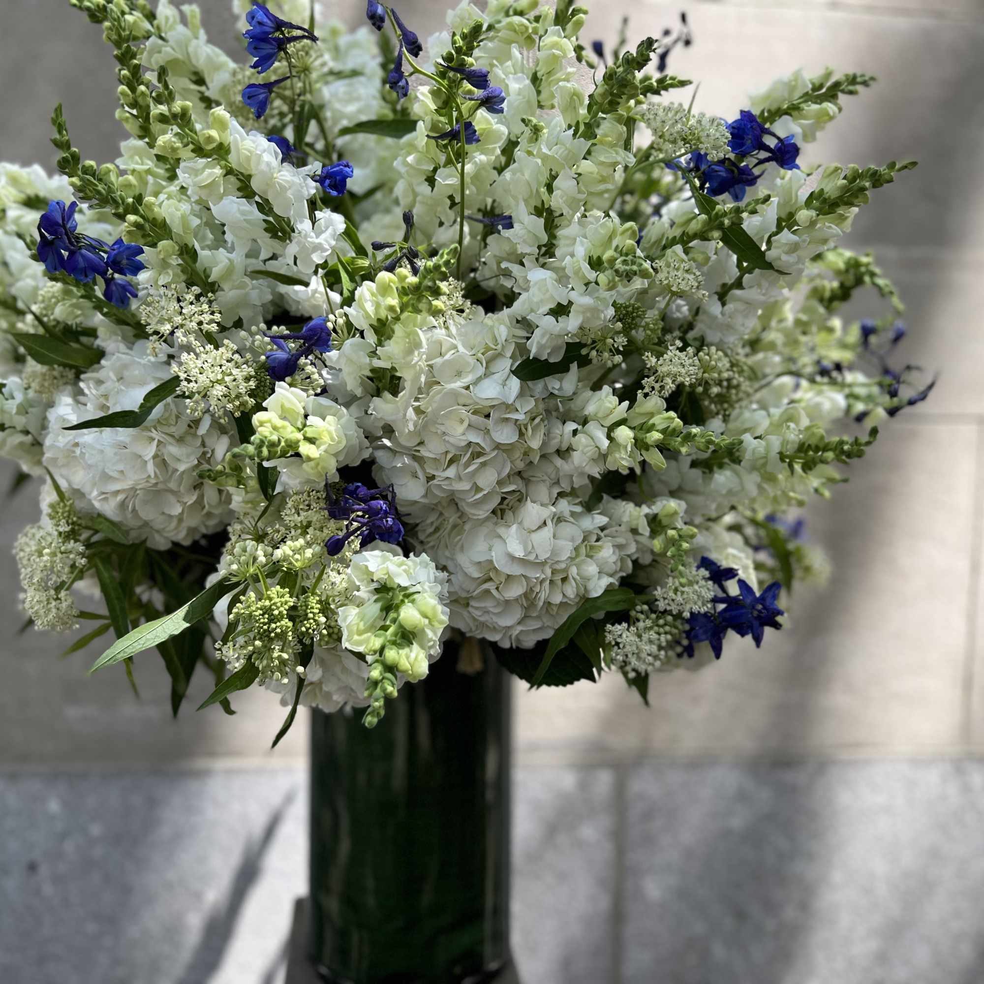 For the service: Features a lush assortment of primarily white color flowers, photo 2 of 7
