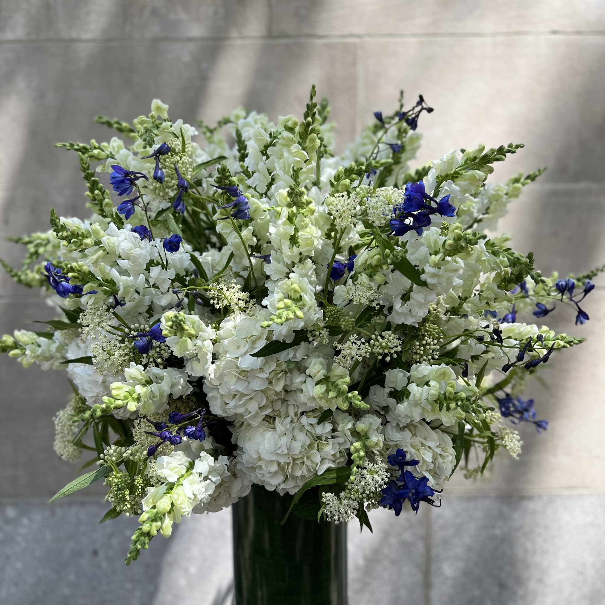 For the service: Features a lush assortment of primarily white color flowers, photo 3 of 7