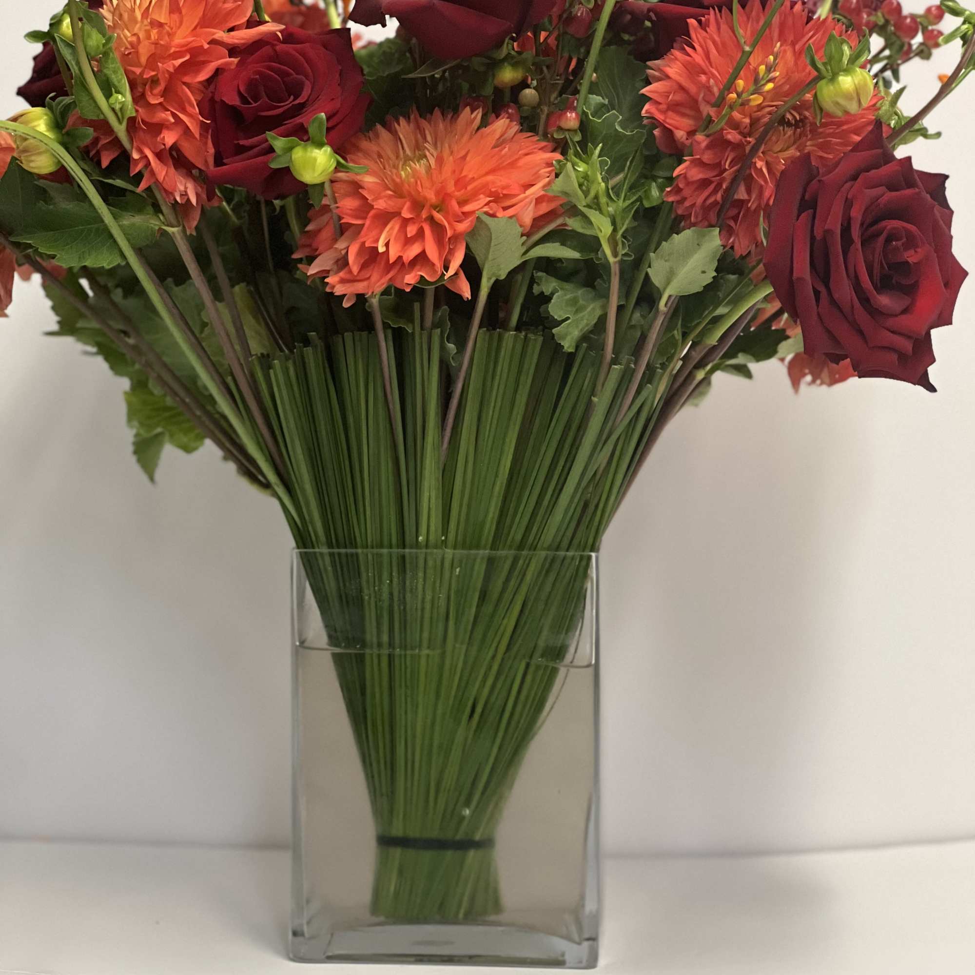 Lush assortment of long stemmed flowers set in a cluster of steel, photo 4 of 6