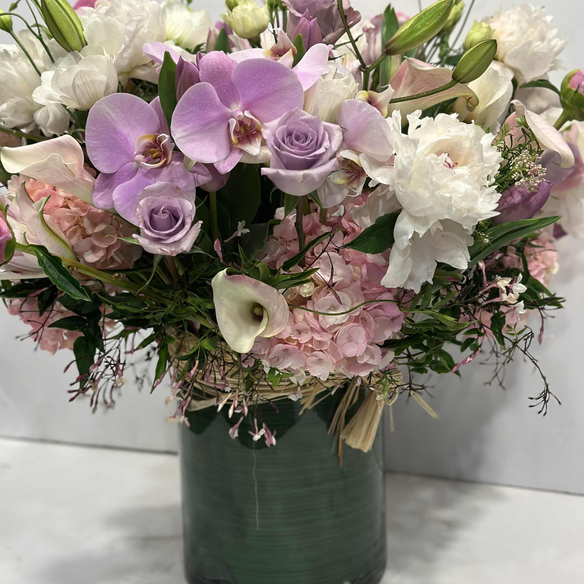 Medium high floral arrangement compose of an assortment of Jules Elie peonies, photo 2 of 7