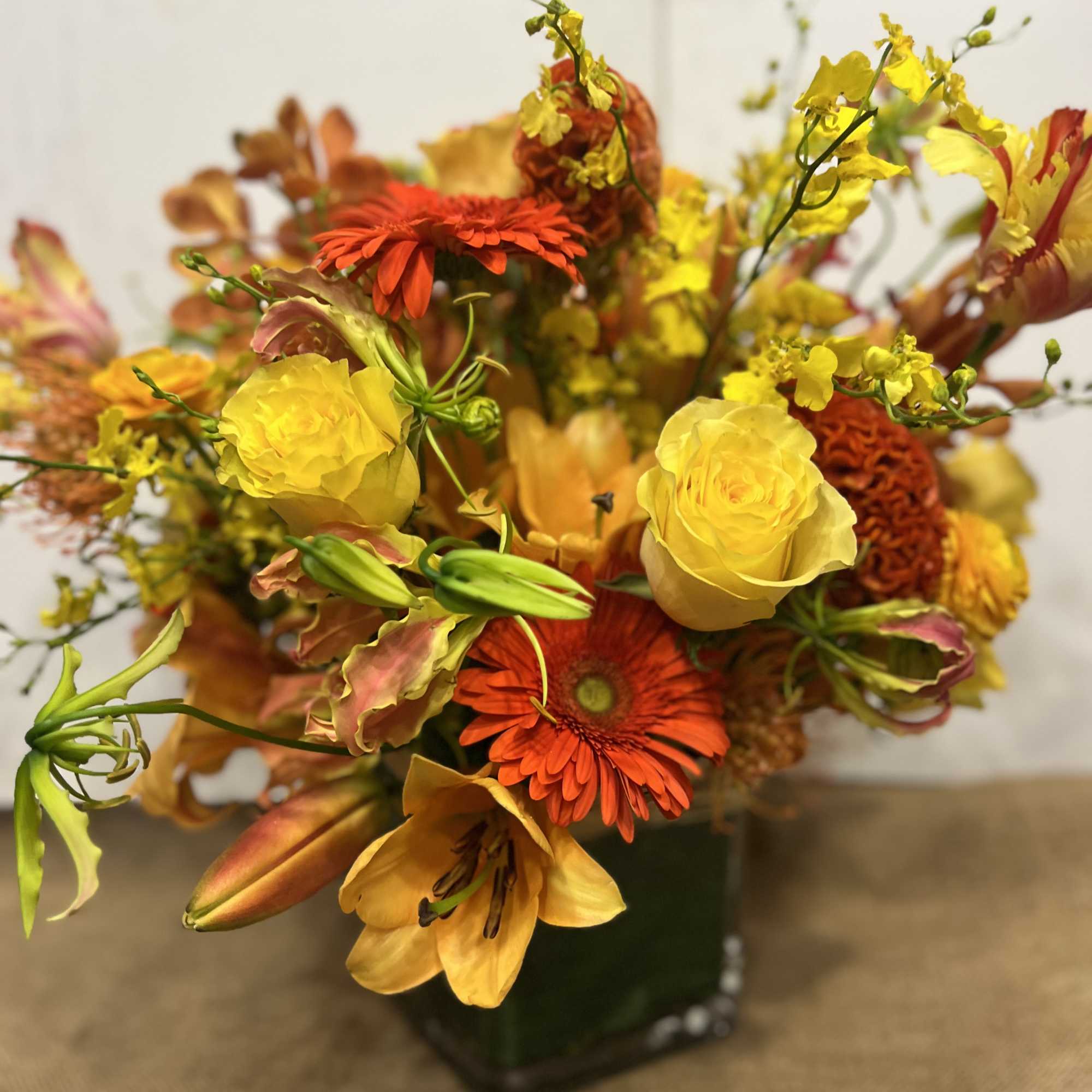 Medium high floral arrangement compose of an assortment of, yellow roses, nutan, photo 3 of 7