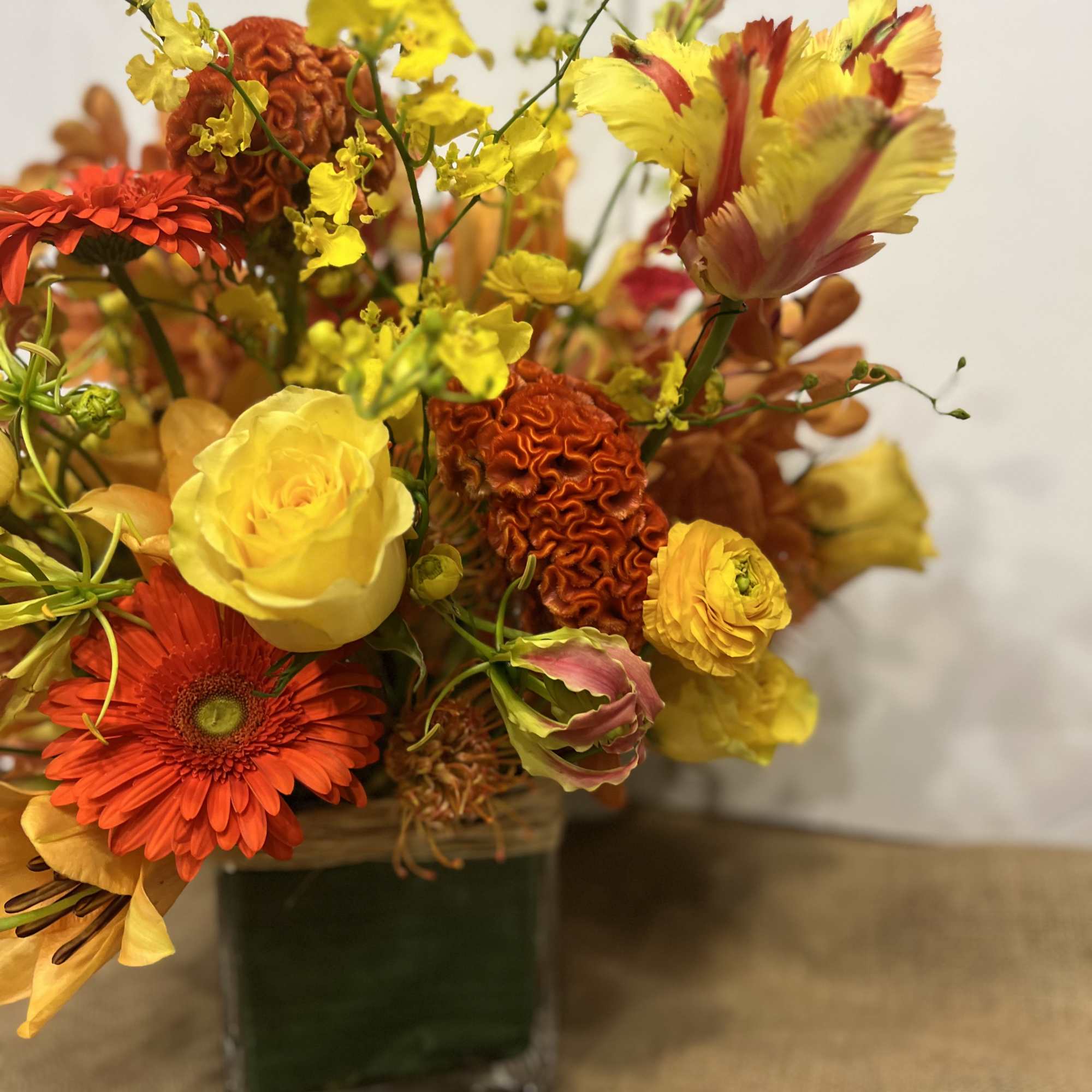 Medium high floral arrangement compose of an assortment of, yellow roses, nutan, photo 6 of 7