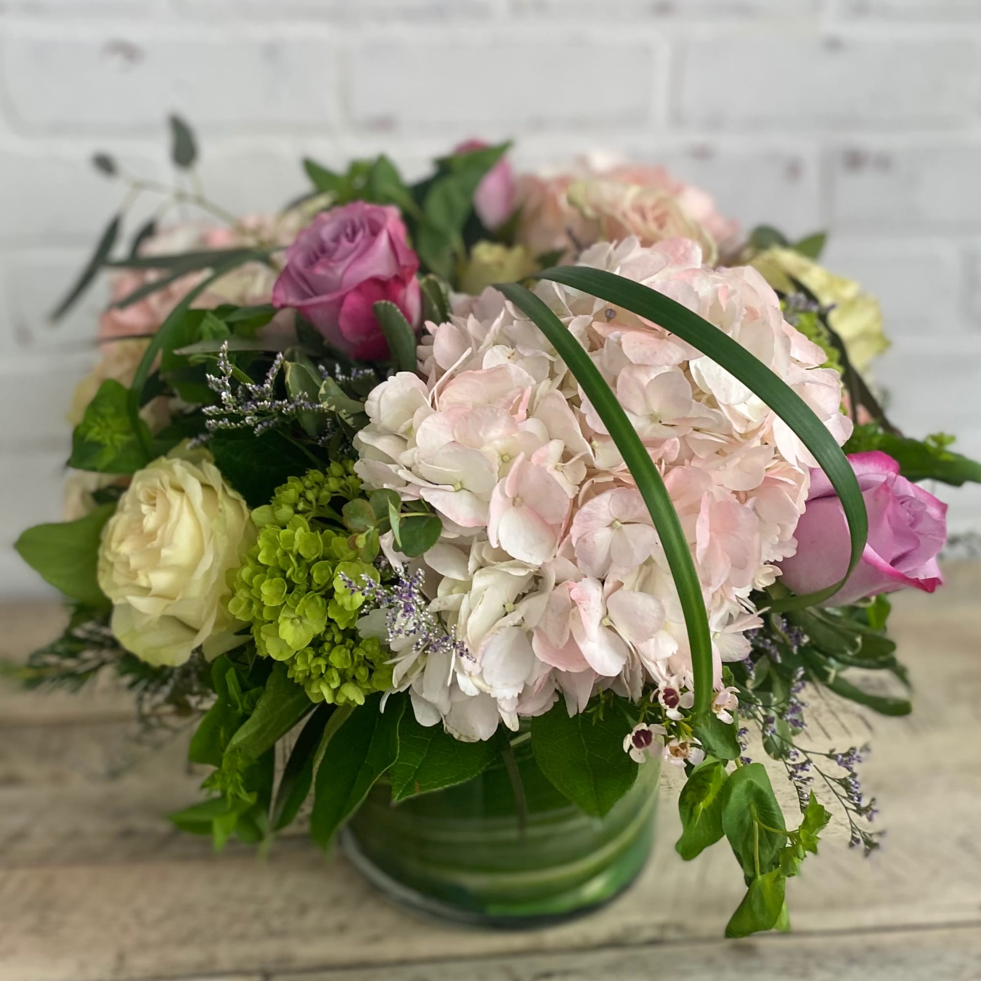 Light colored blooms of soft pinks, whites, green, and touches of purple., photo 2 of 3