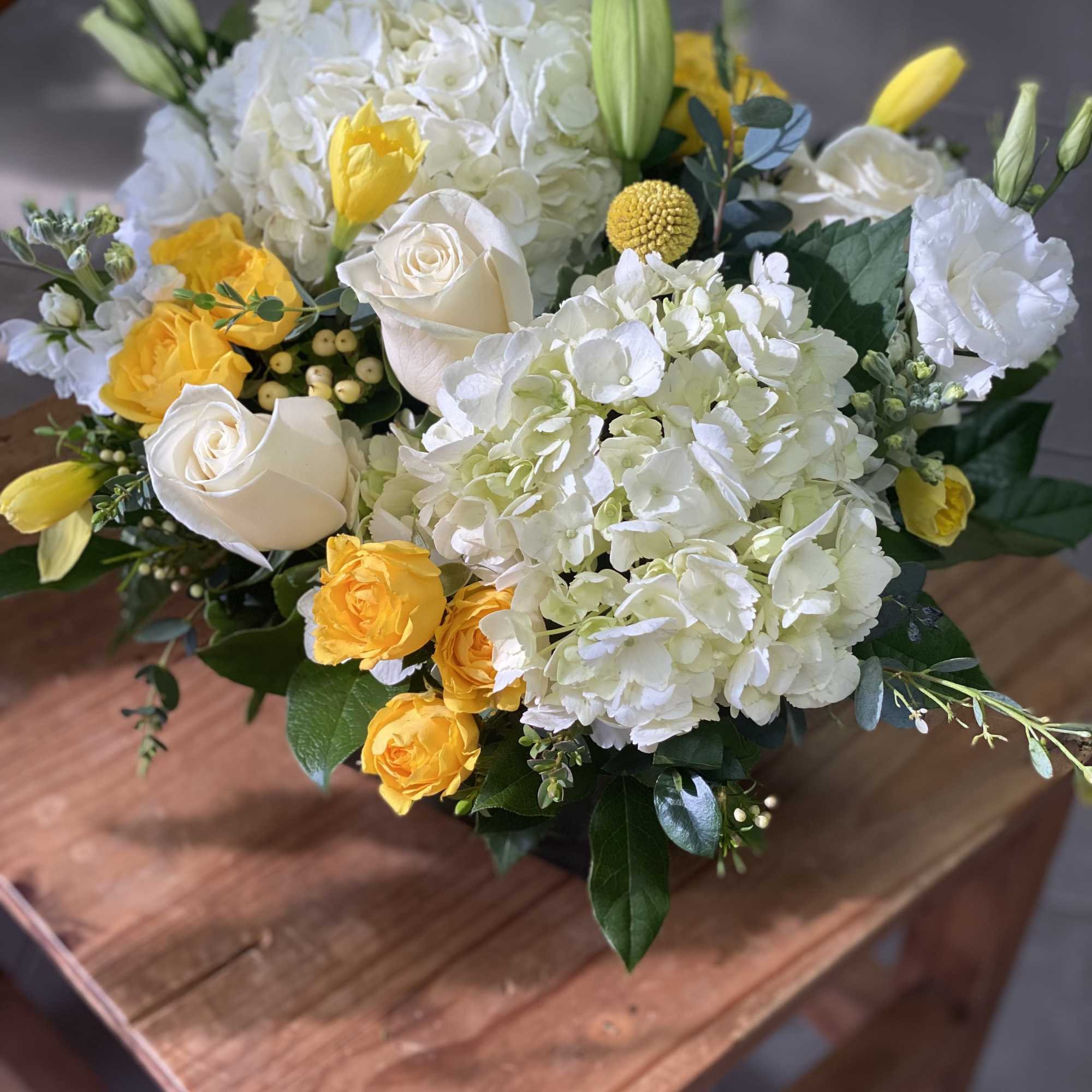 White and yellow floral bouquet with roses and hydrangeas