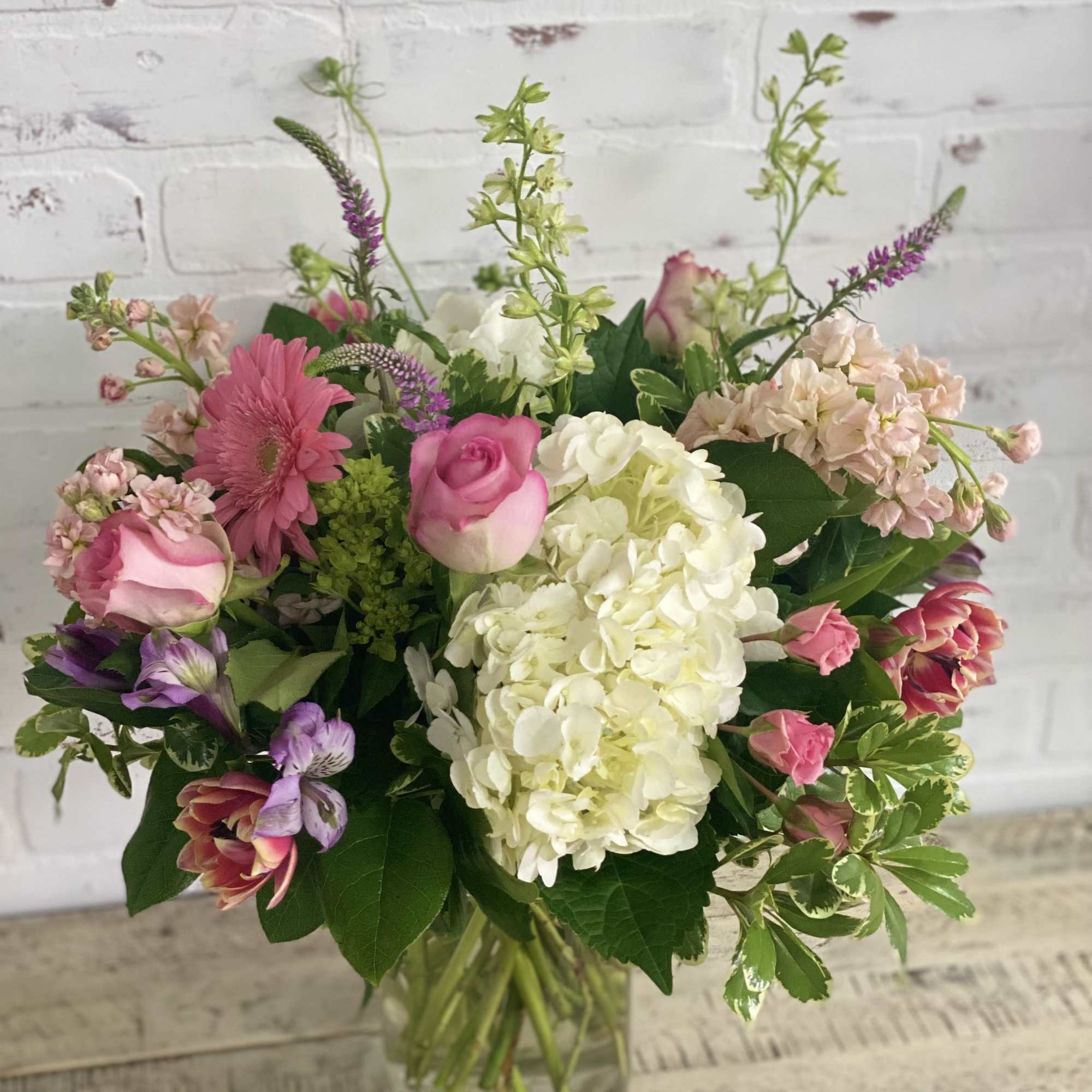 Mixed pink and white bouquet in a clear glass vase