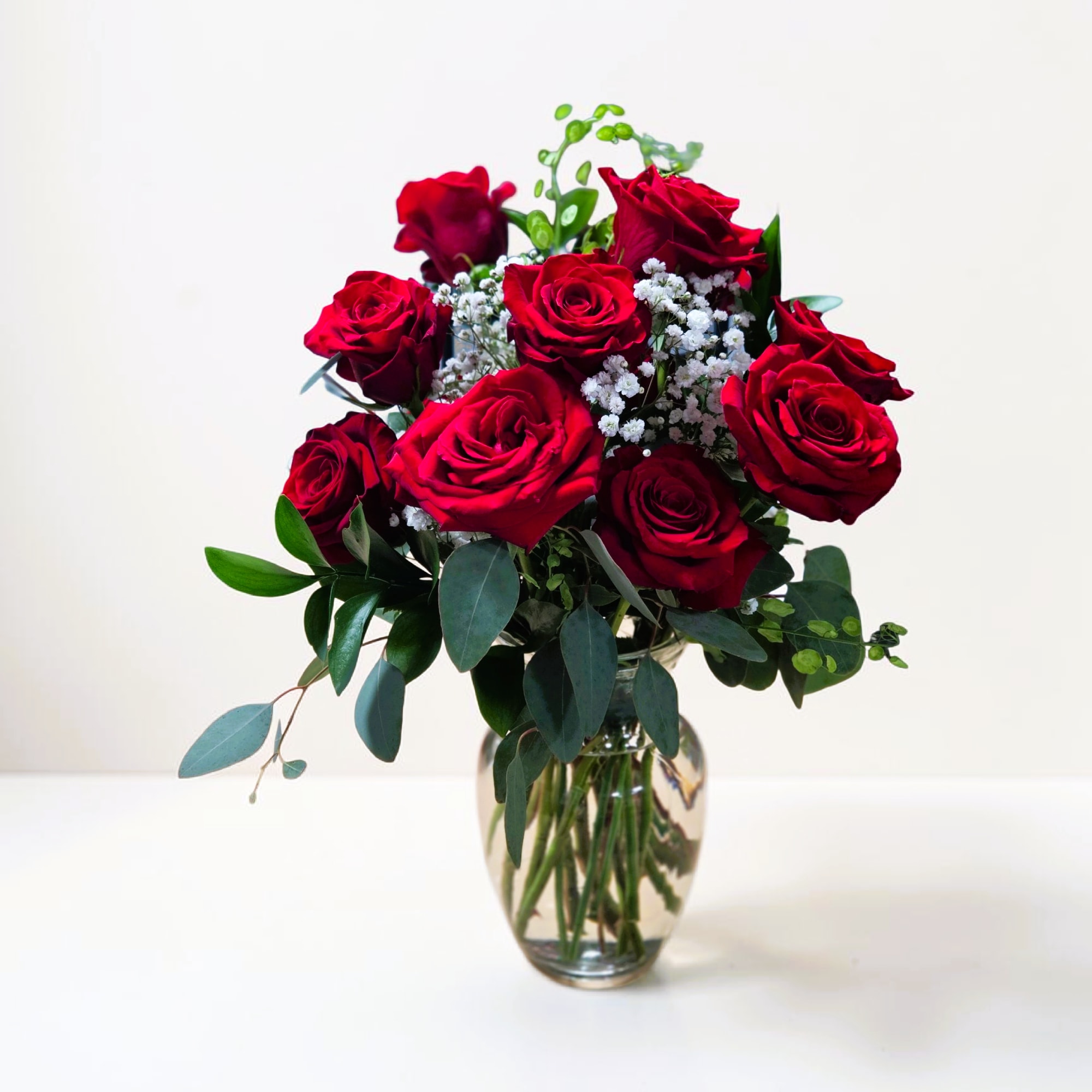 One dozen red roses with baby's breath... classic! Perfect romantic gift for