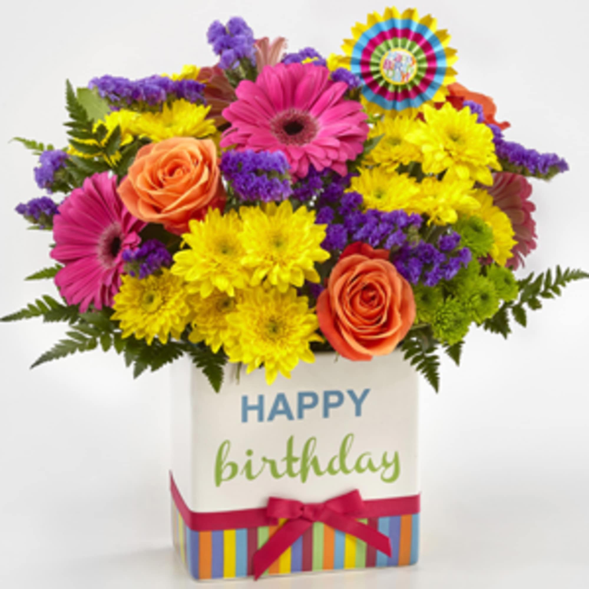 Colorful bouquet of roses, gerbera daisies, and yellow mums in a birthday gift box