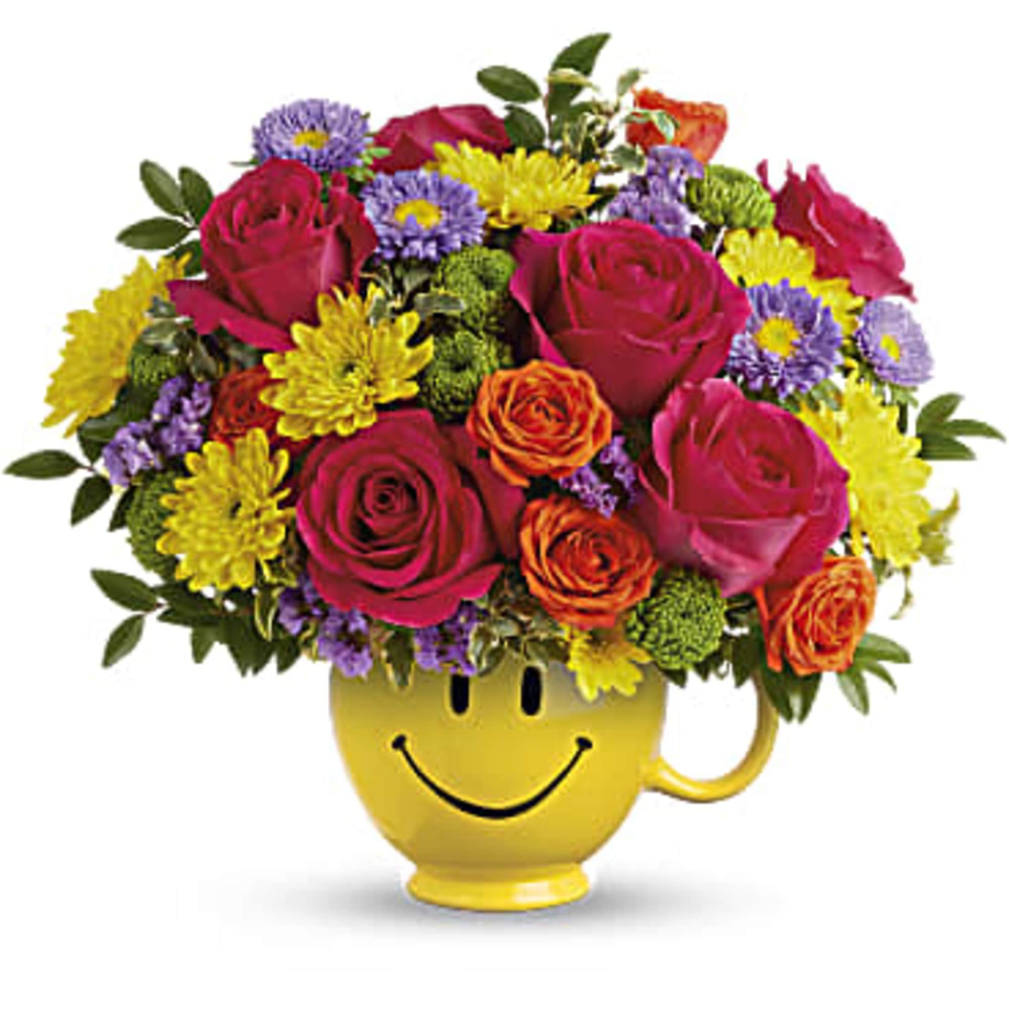 Mixed bouquet in a yellow smiley-face mug
