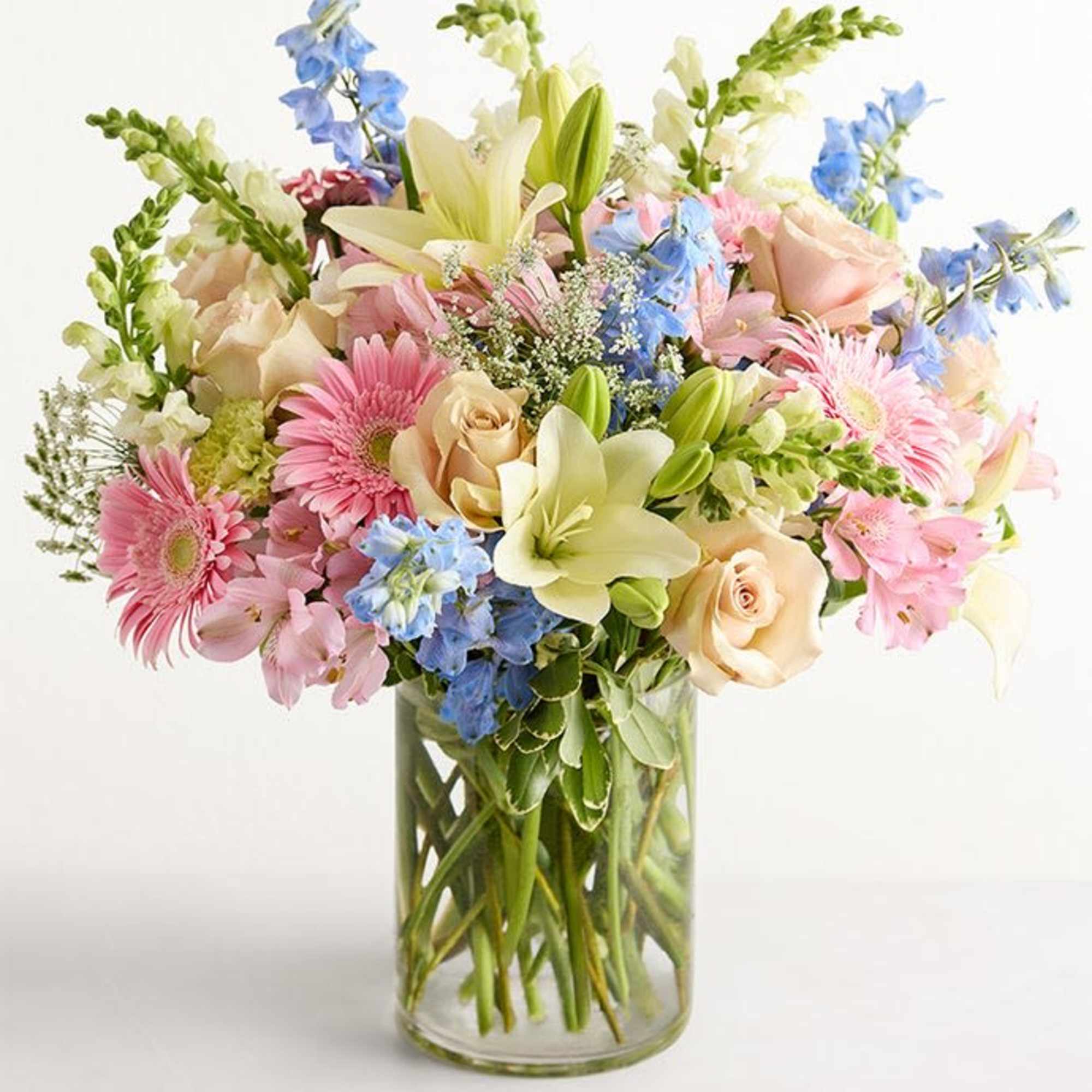Mixed pastel bouquet in a clear glass vase