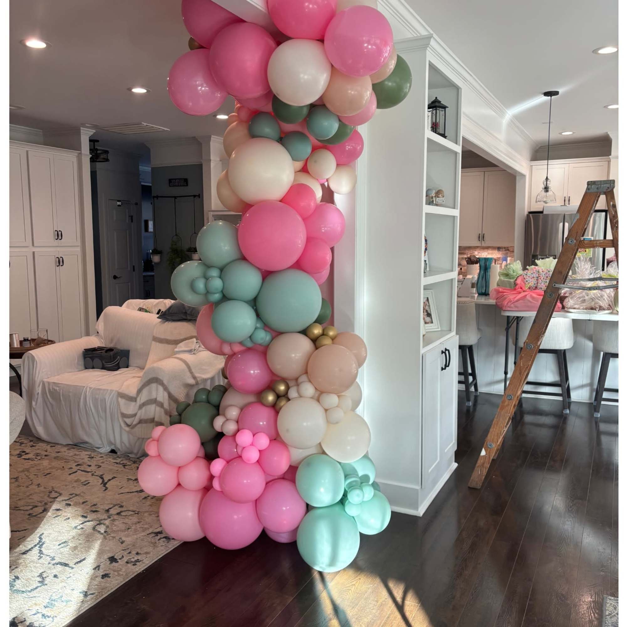 Pastel balloon column in pink, mint, white, and beige