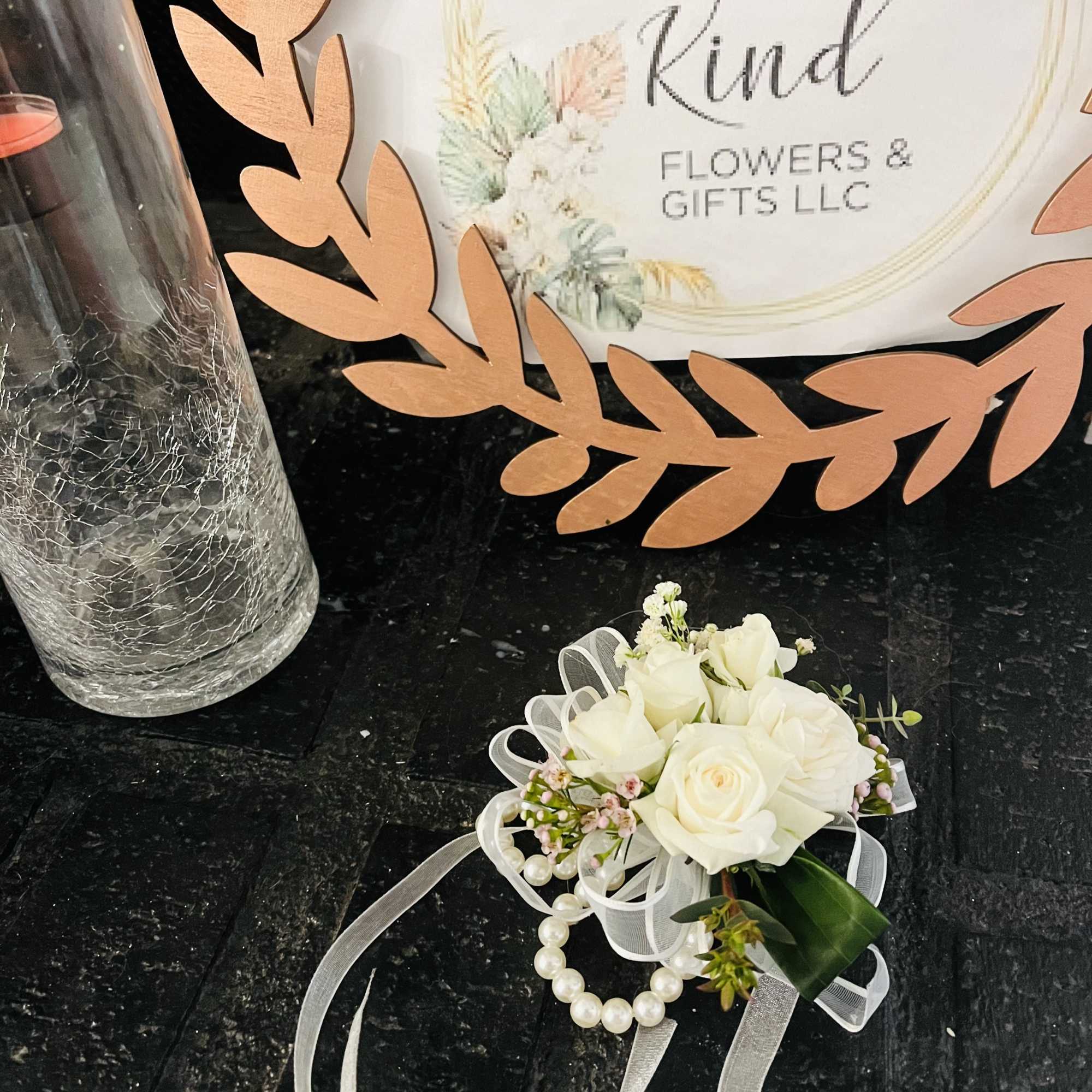 White rose corsage with ribbon and pearl accents