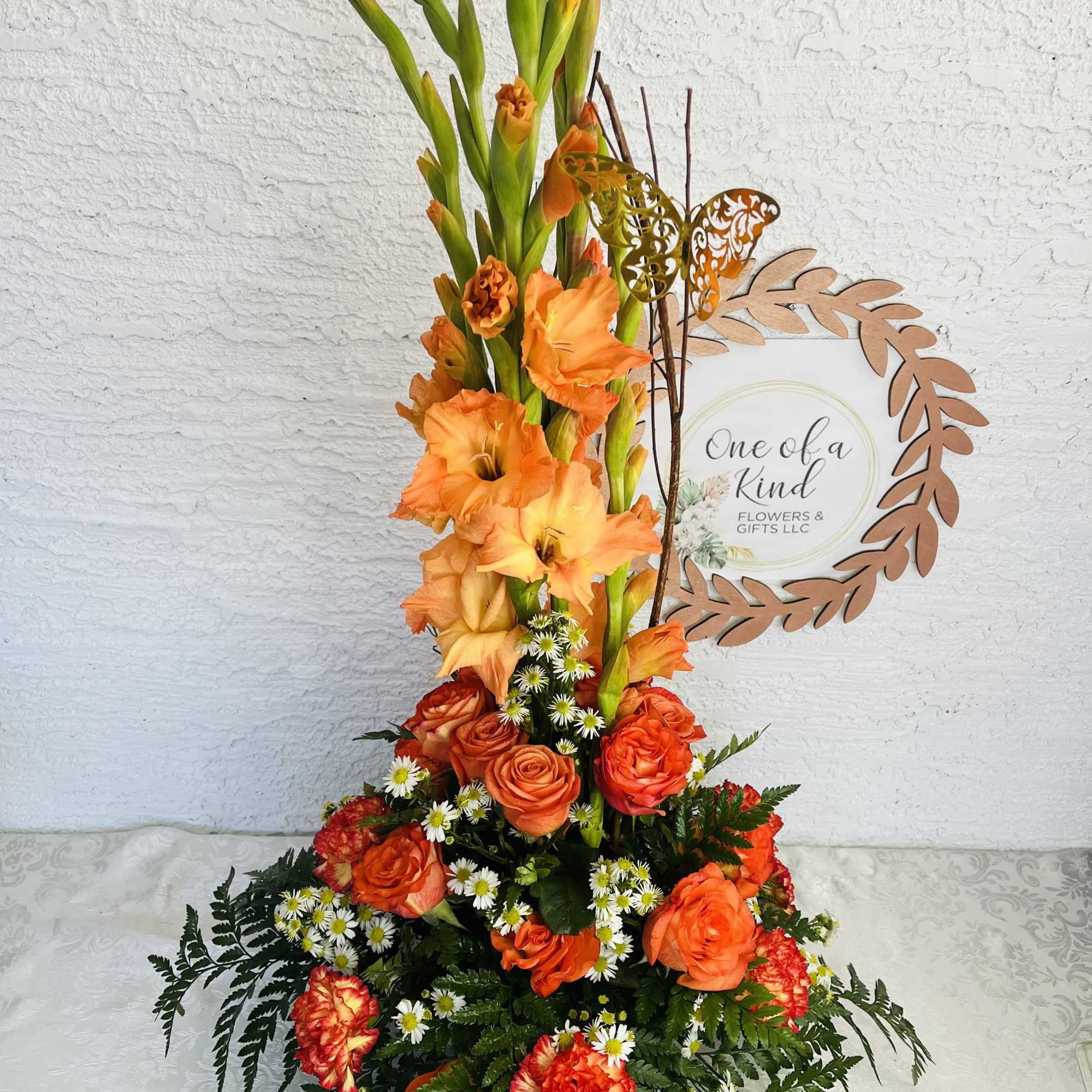 Tall orange floral arrangement with roses and gladiolus, photo 3 of 3