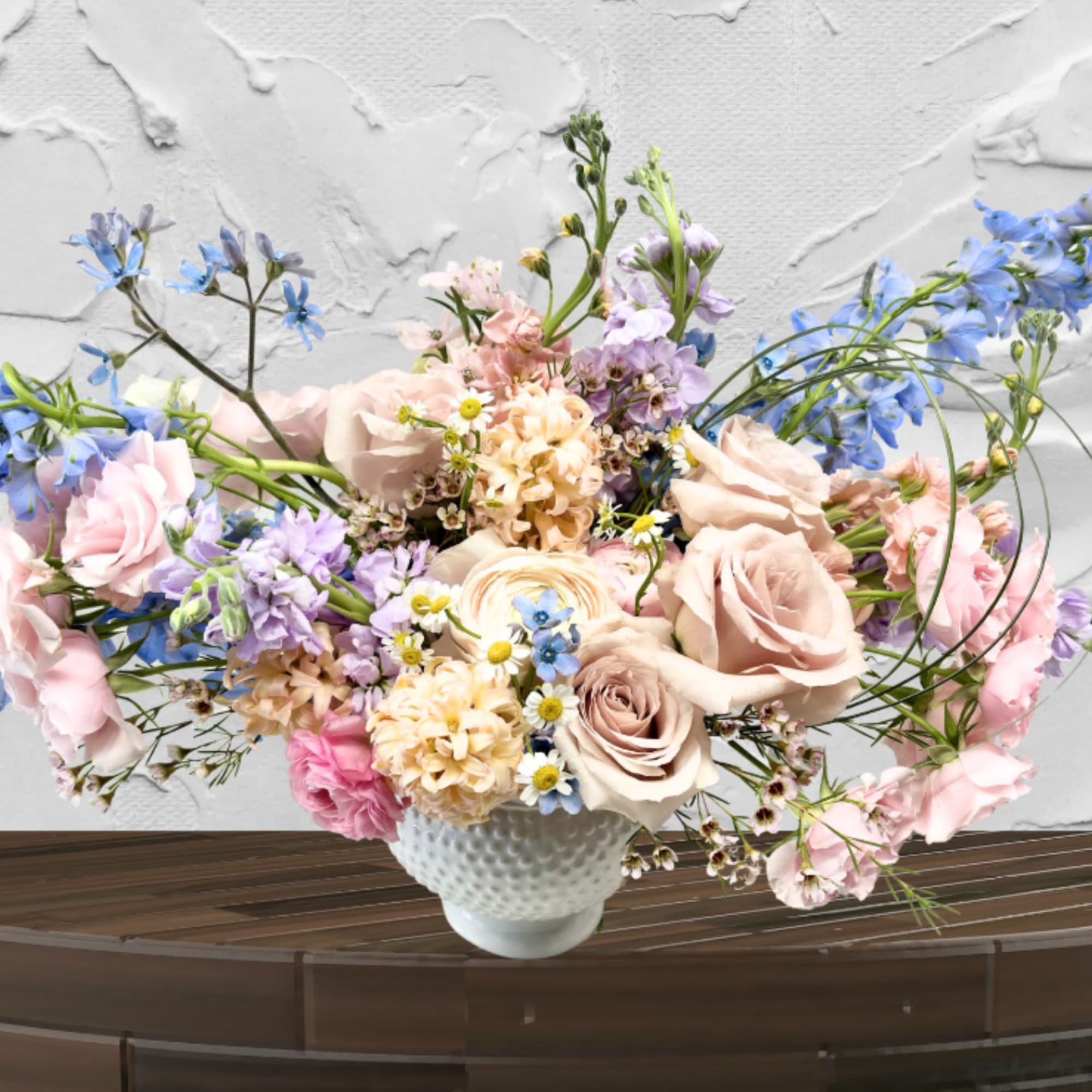 "Hand-crafted by accredited Master Florist Tricia Won (AIFD, EMC, IMF) No two