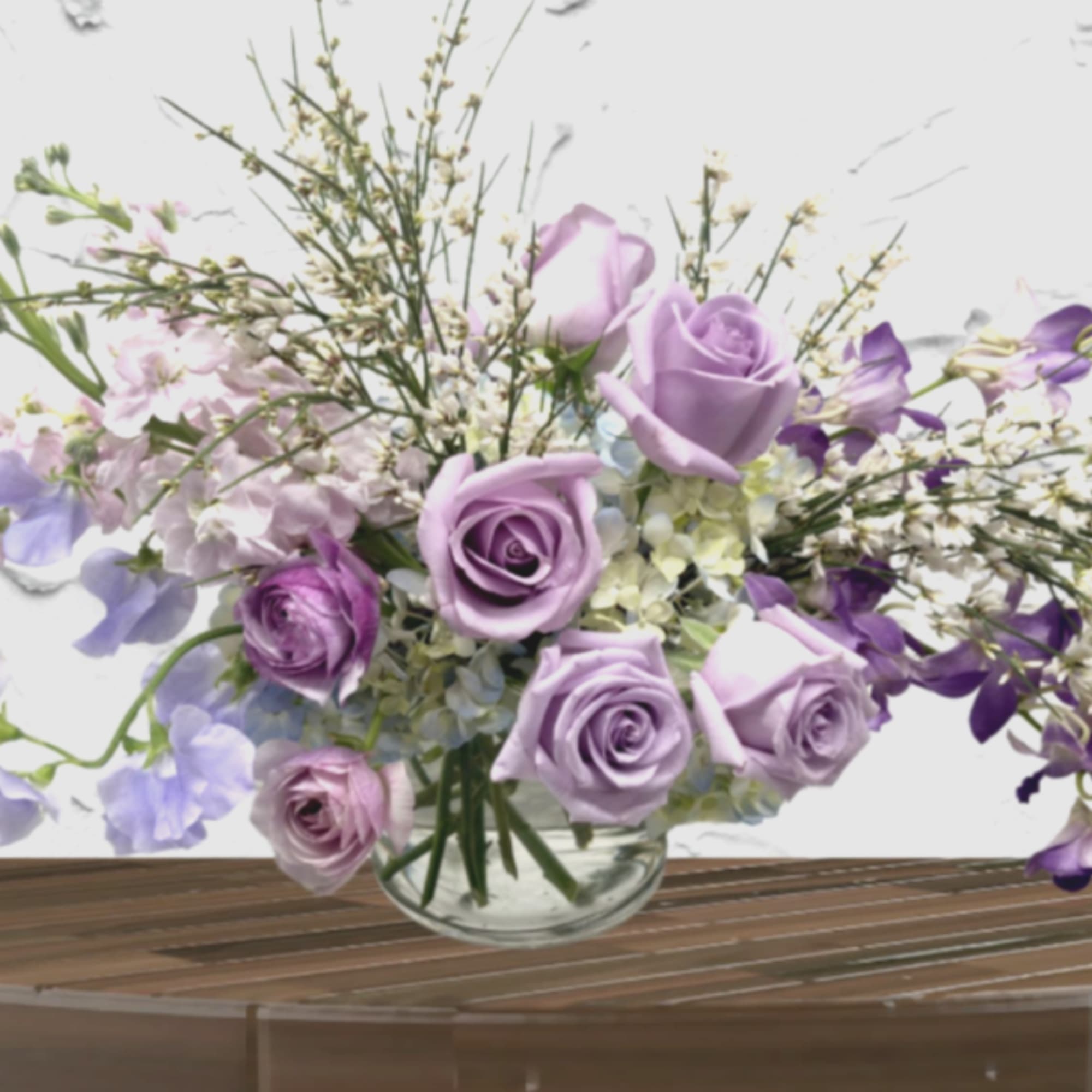 "Hand-crafted by accredited Master Florist Tricia Won (AIFD, EMC, IMF) No two