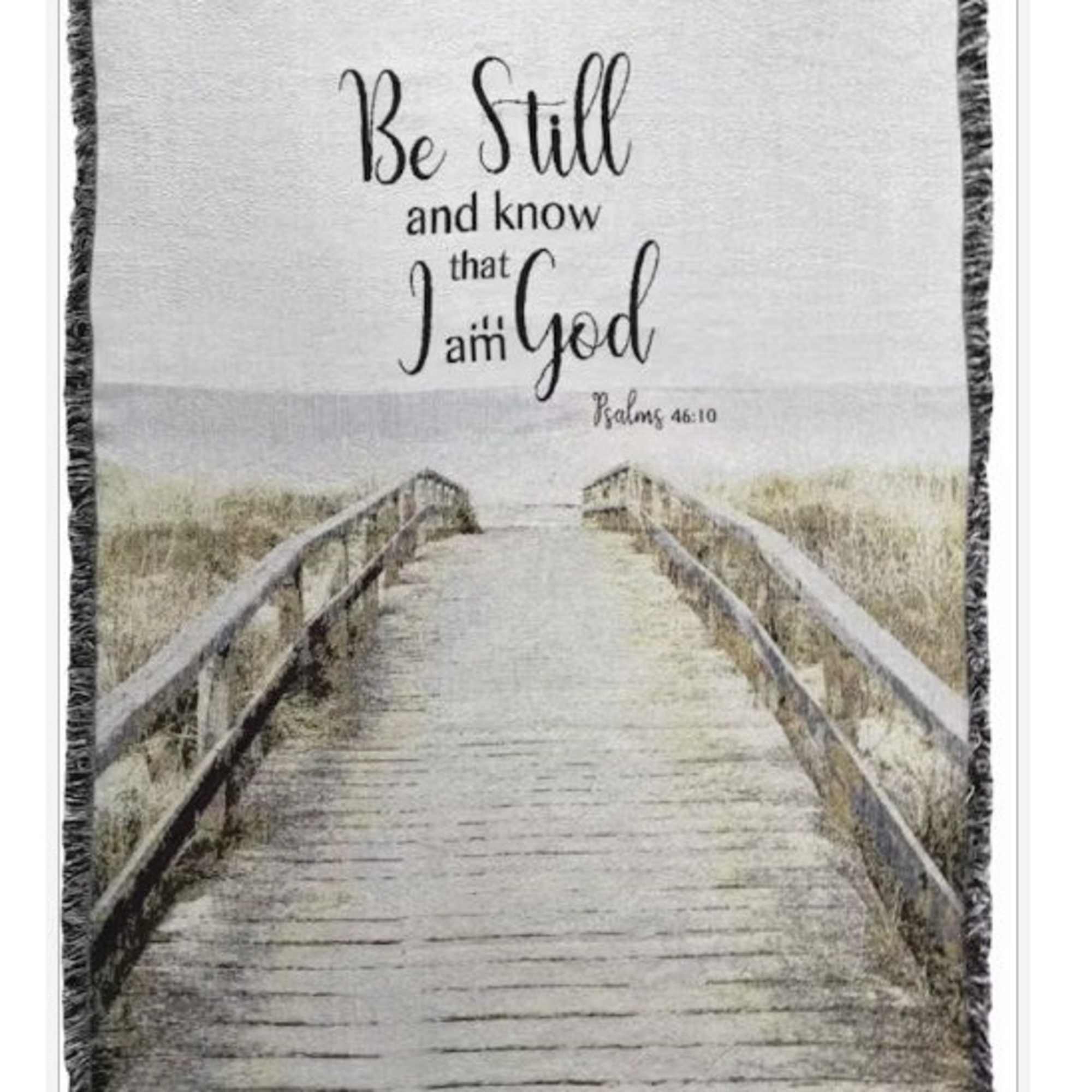 Framed wall hanging with a boardwalk scene and the words "Be Still and know that I am God"