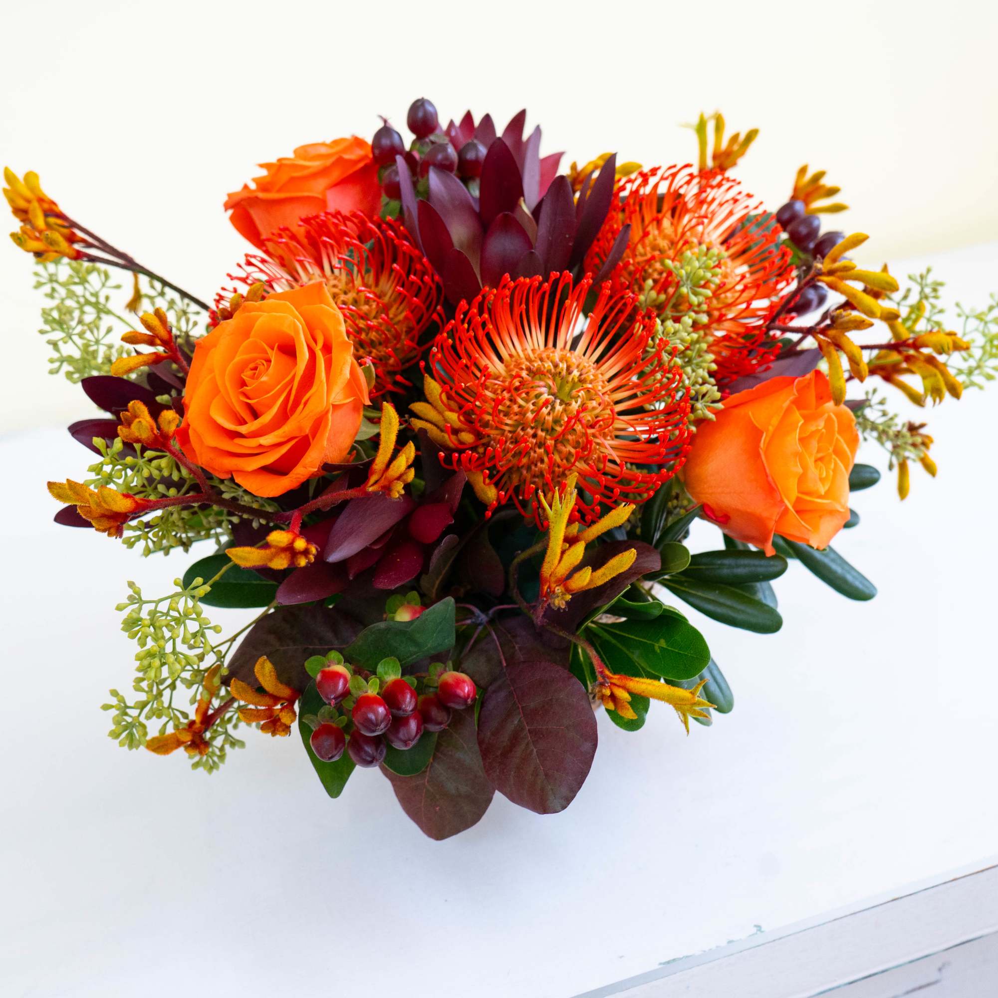 Gorgeous harvest-themed arrangement in a round, birch container featuring beautiful orange hues, photo 4 of 4