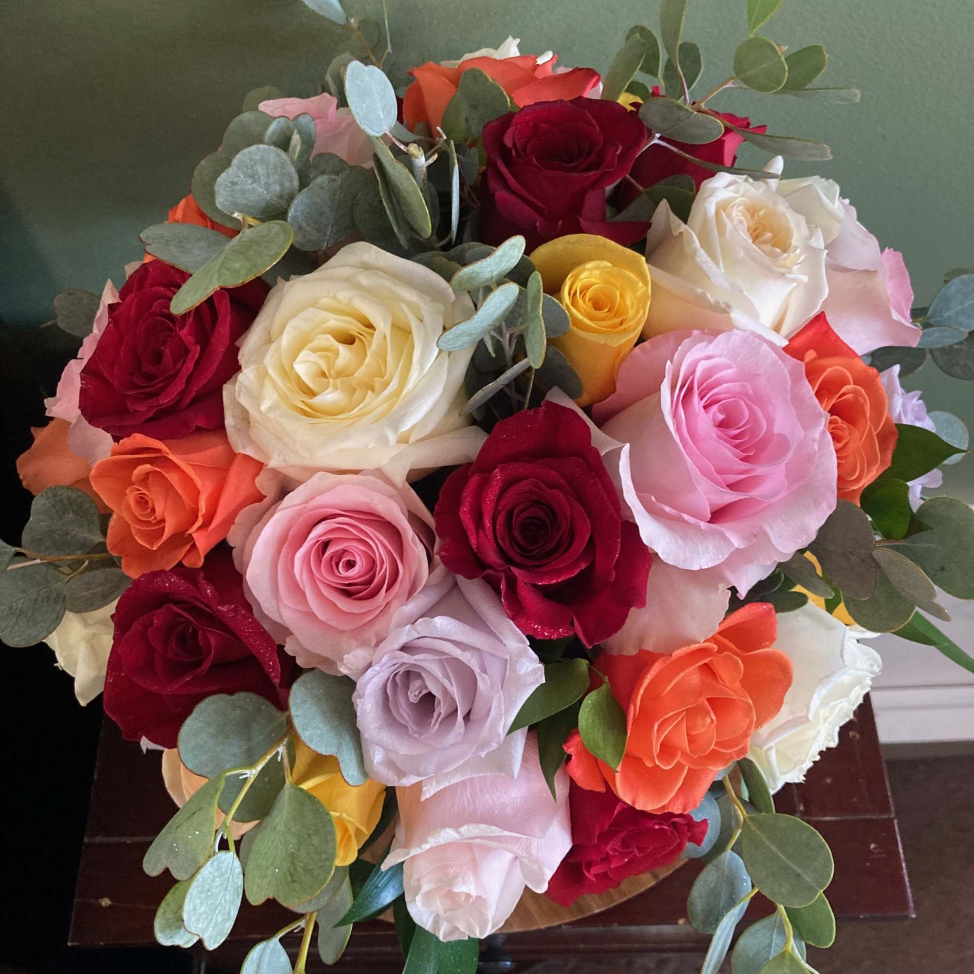 Mixed bouquet of roses in red, pink, white, orange, and yellow