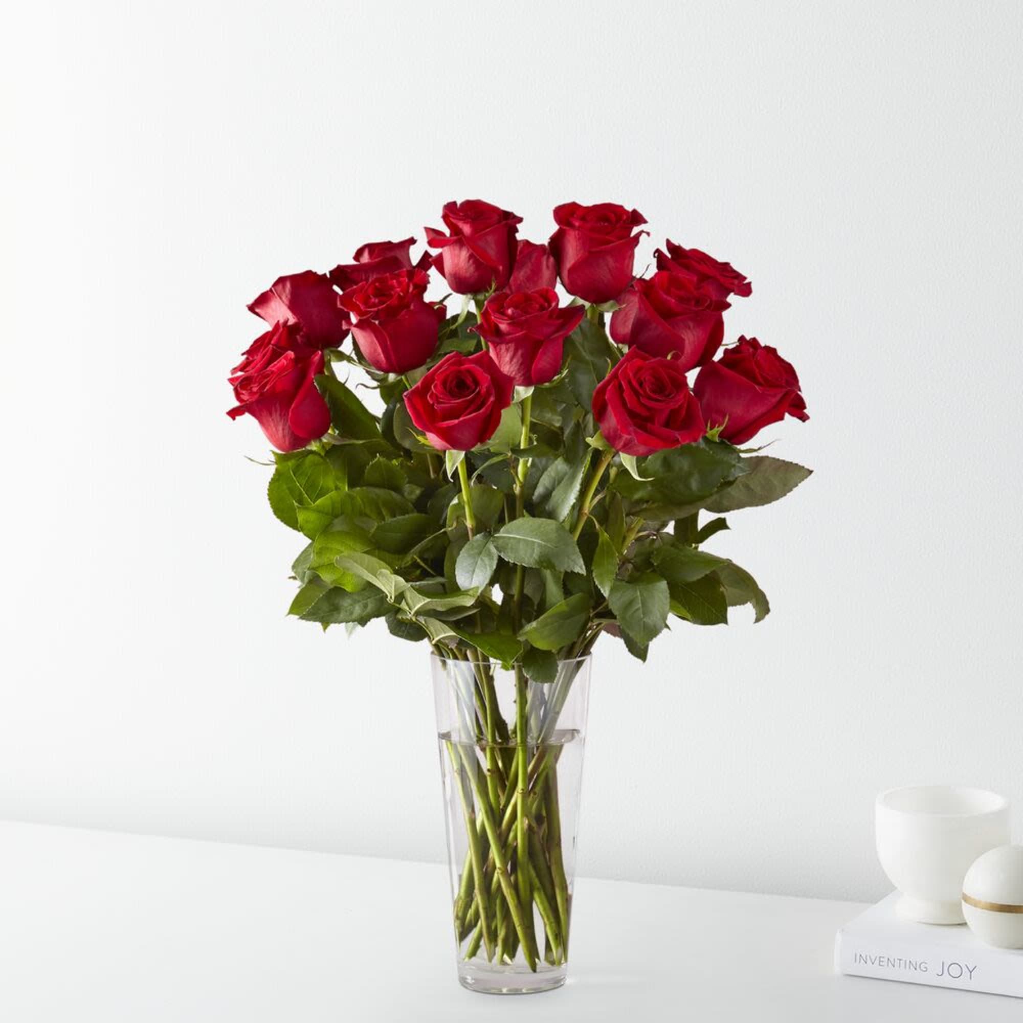 Bouquet of red roses in a clear glass vase