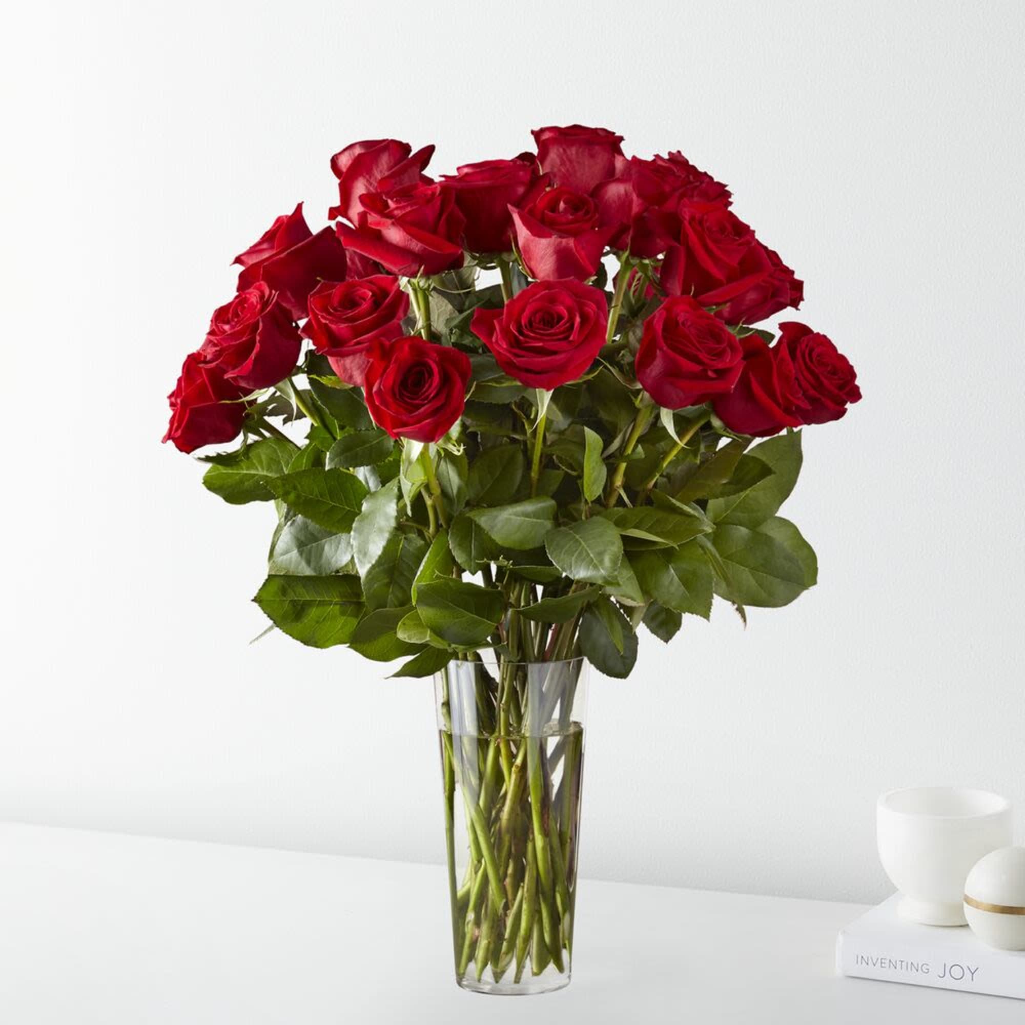 Bouquet of red roses in a clear glass vase