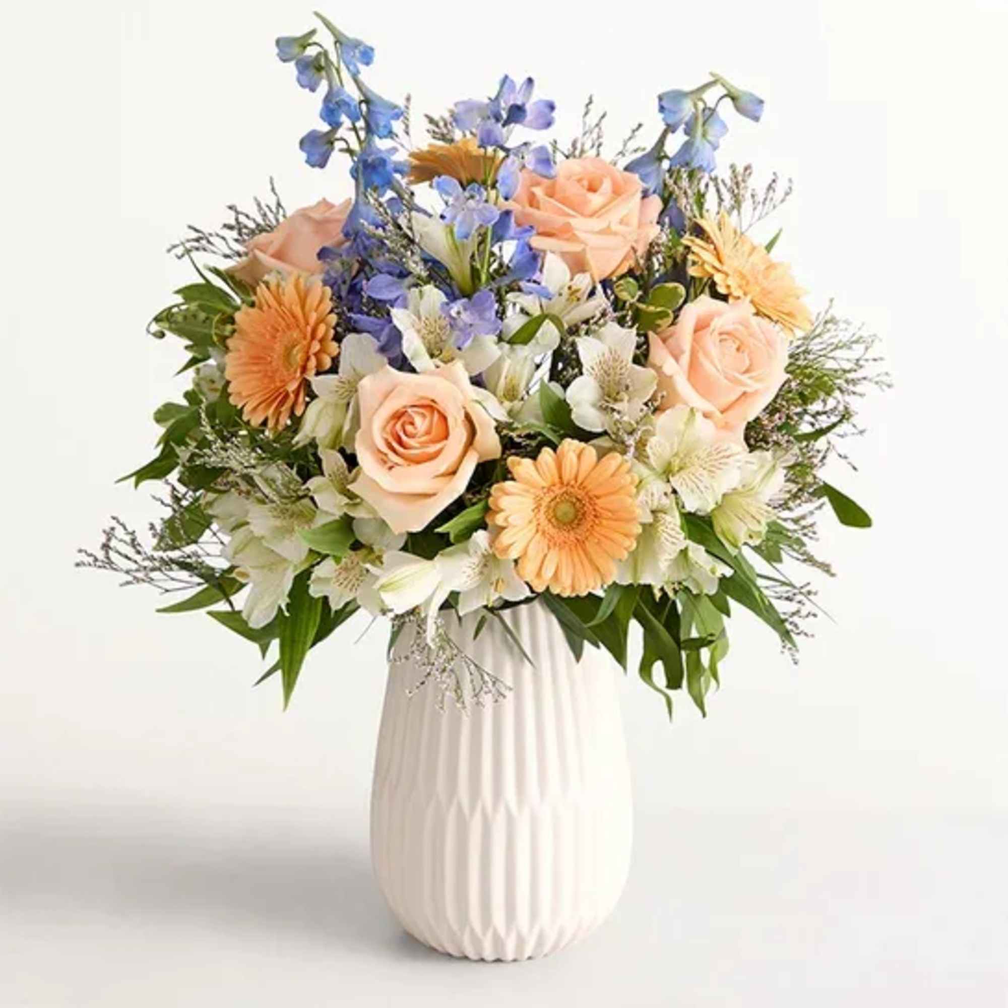 Our gathering of roses, Peruvian lilies, and other blooms evokes salt-kissed