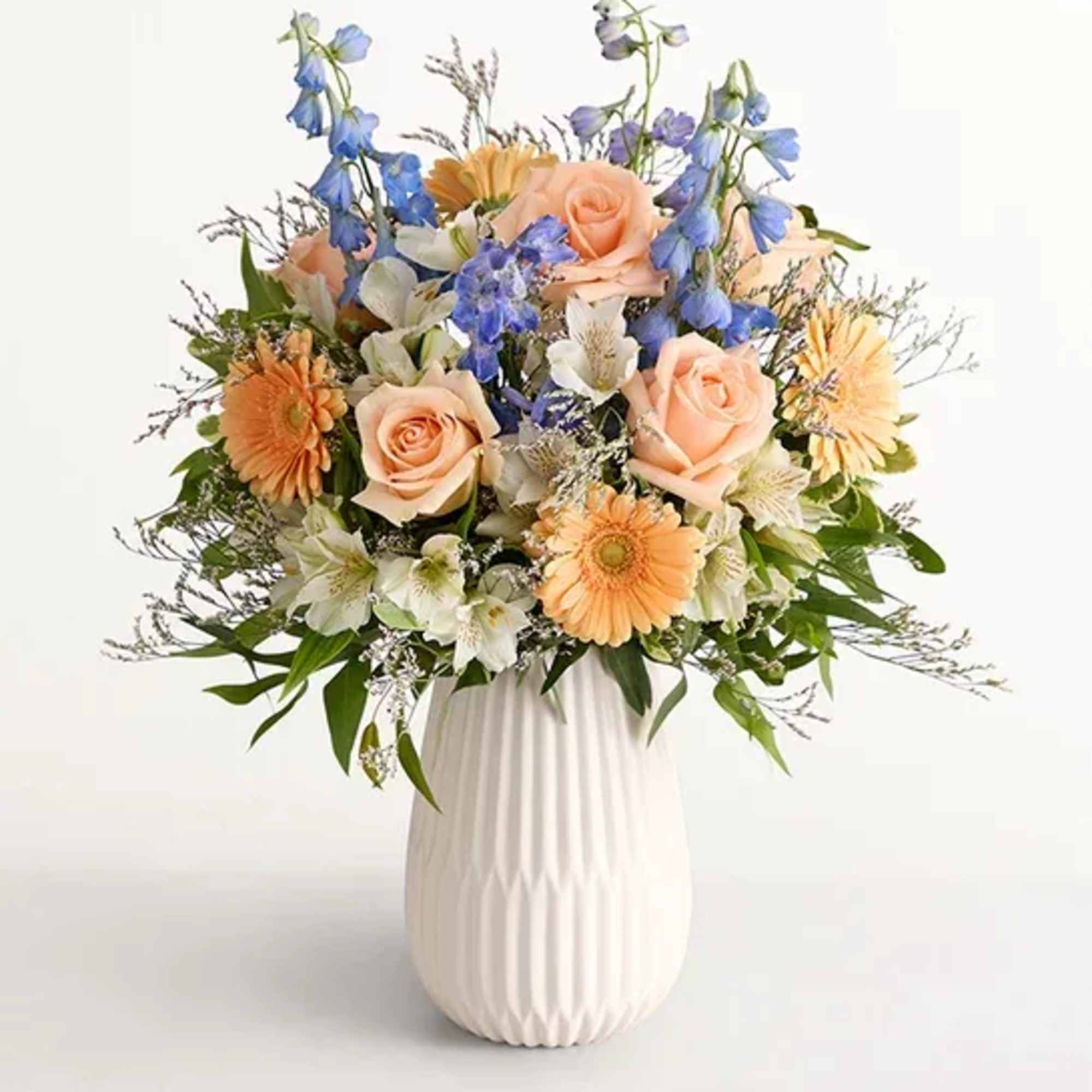  Our gathering of roses, Peruvian lilies, and other blooms evokes salt-kissed