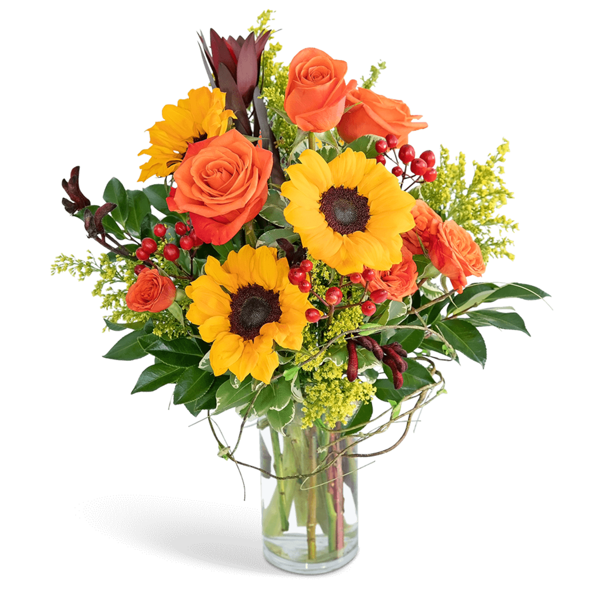 Orange roses and sunflowers in a clear glass vase