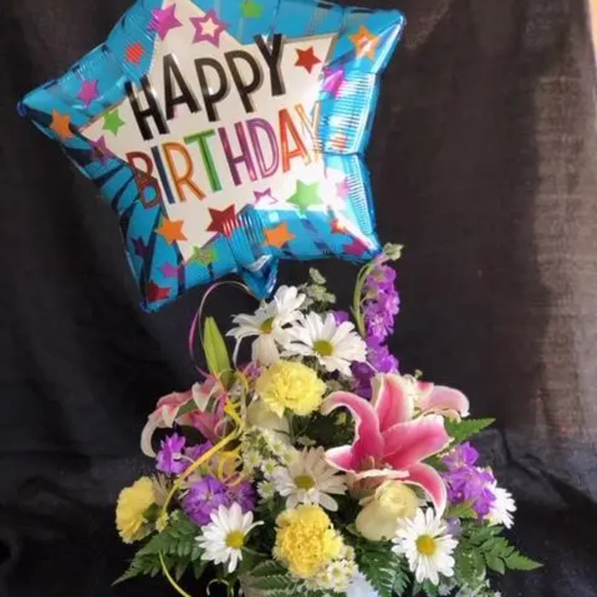  Arriving with a bright mylar balloon exclaiming, "Happy Birthday", this flower