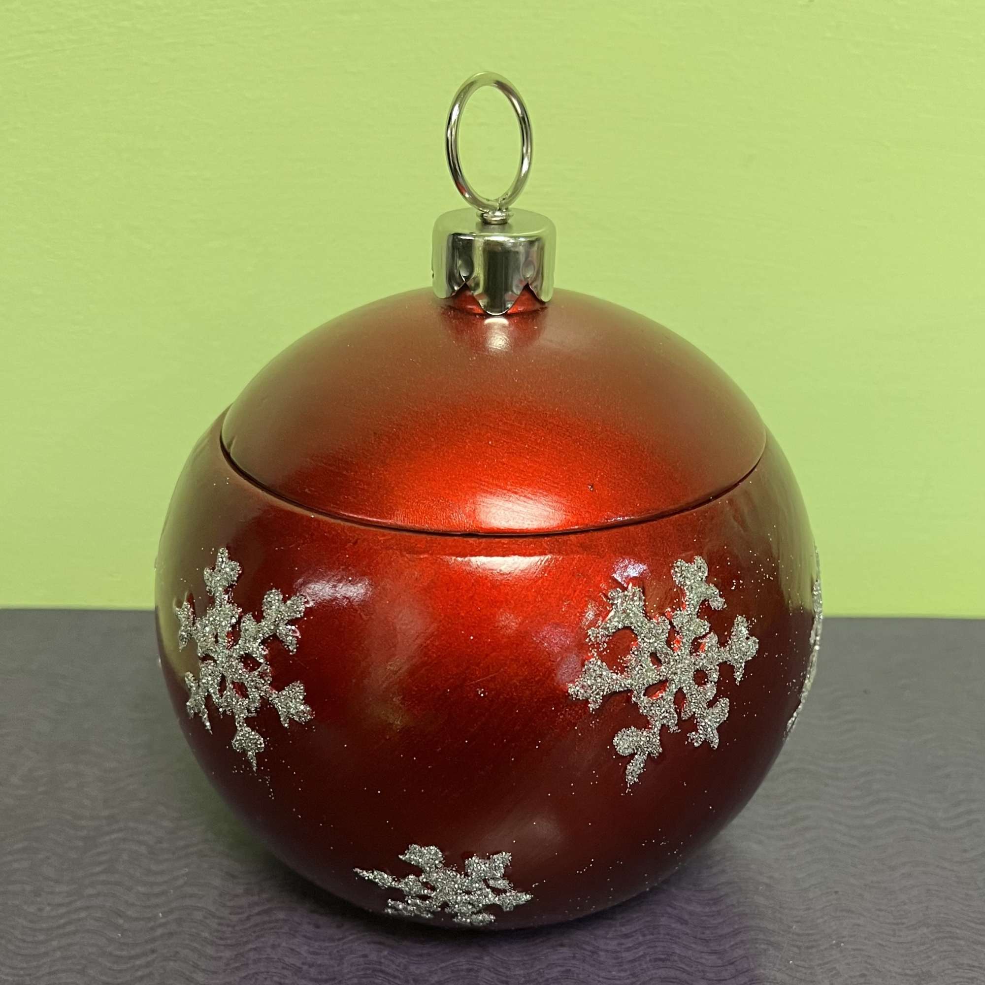 Red Christmas ornament with silver snowflakes