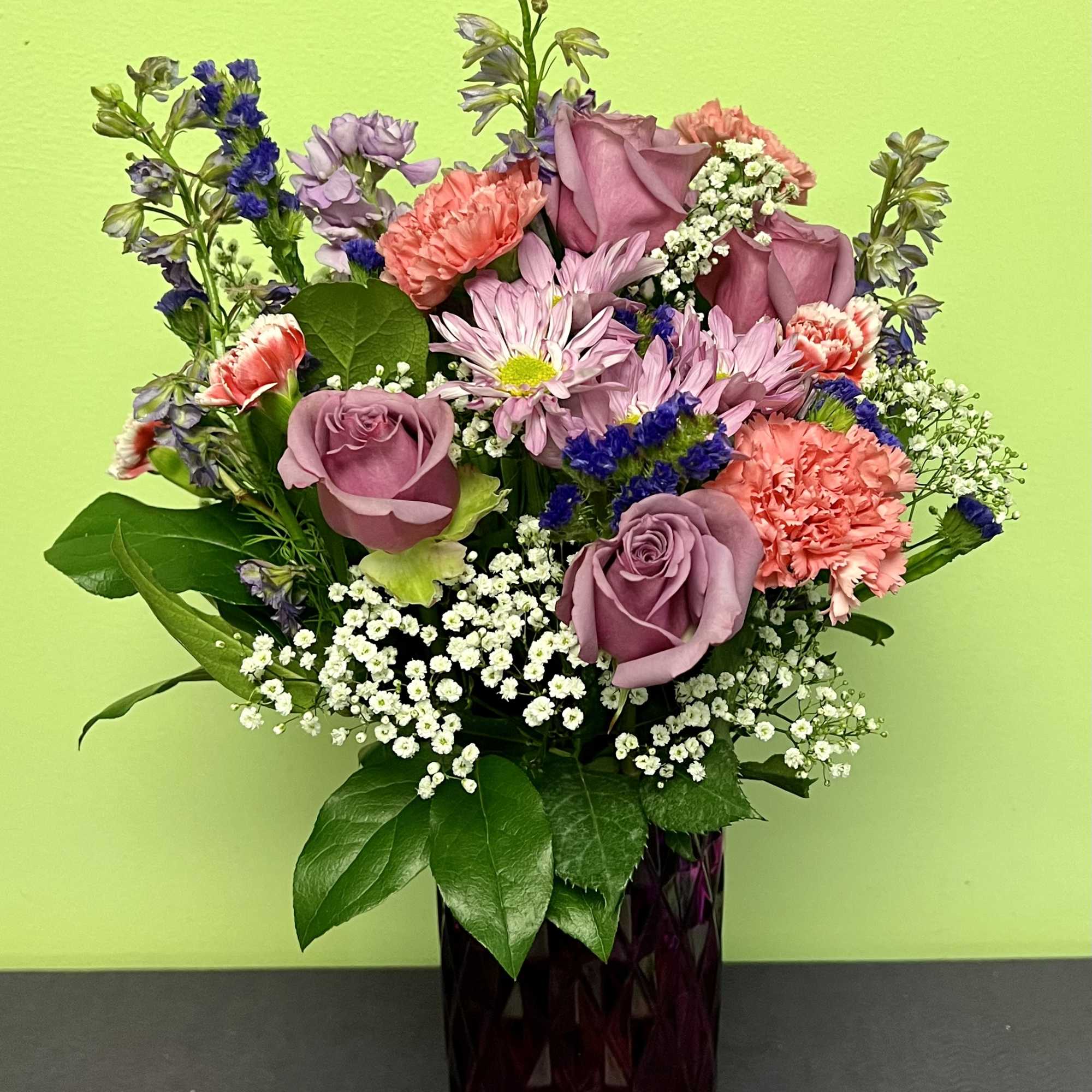 This gorgeous purple vase has a unique design that will go perfect
