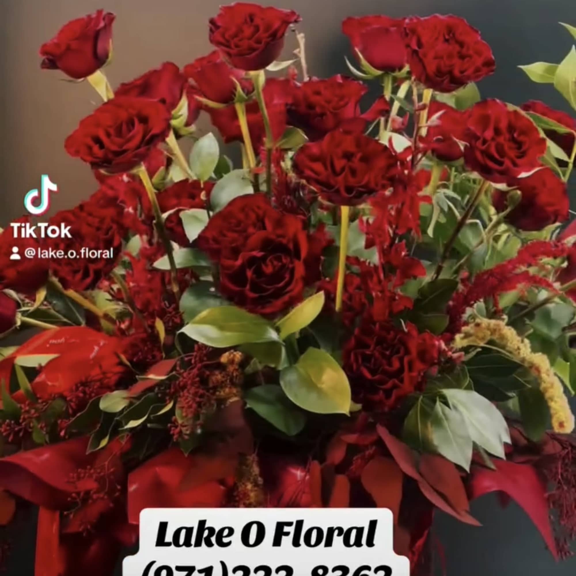 A striking arrangement of velvety red  hearts roses ,artfully composed with