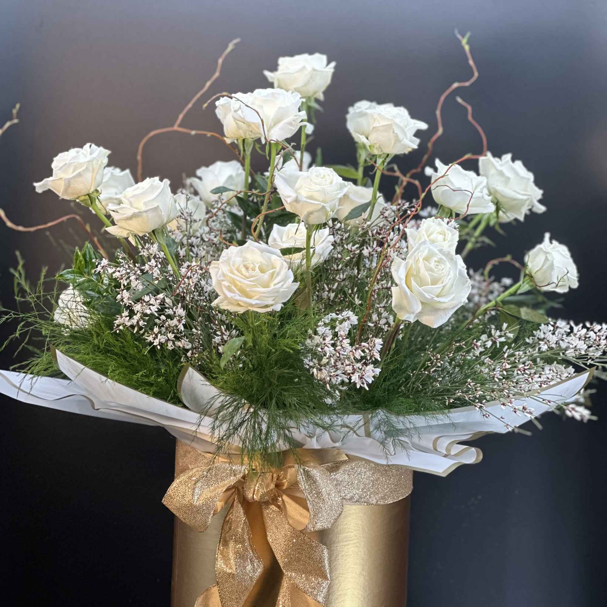 A striking arrangement of velvety red  hearts roses ,artfully composed with, photo 2 of 2