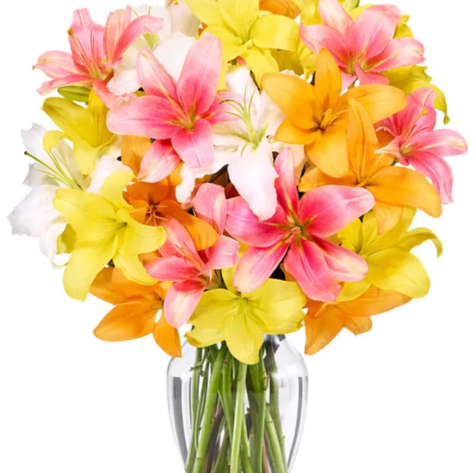 Bouquet of pink, yellow, and orange lilies in a clear glass vase