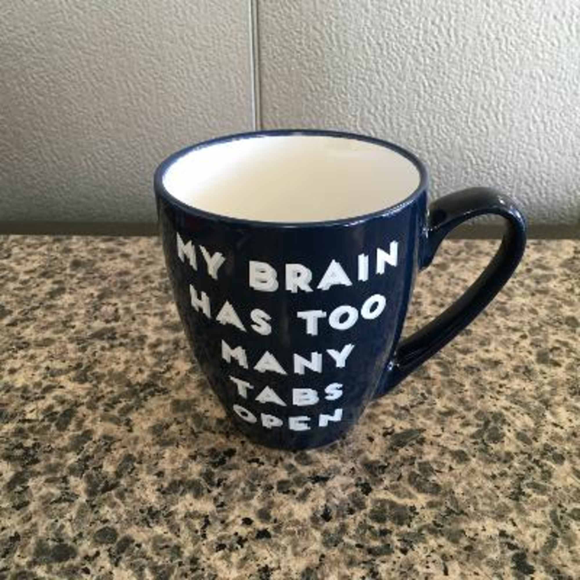 Navy mug with white text reading "MY BRAIN HAS TOO MANY TABS OPEN"