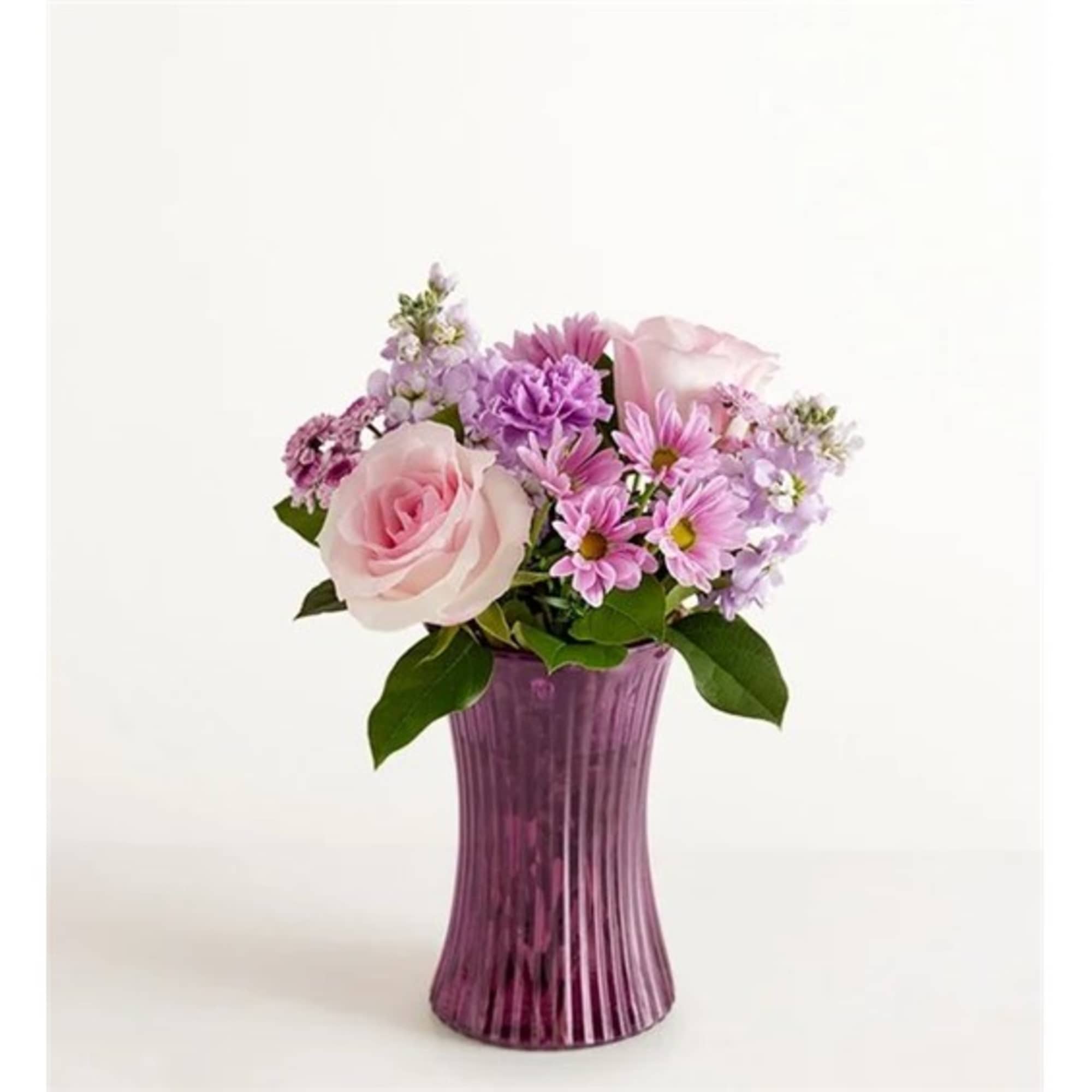 Pink and lavender flowers arranged in a purple vase