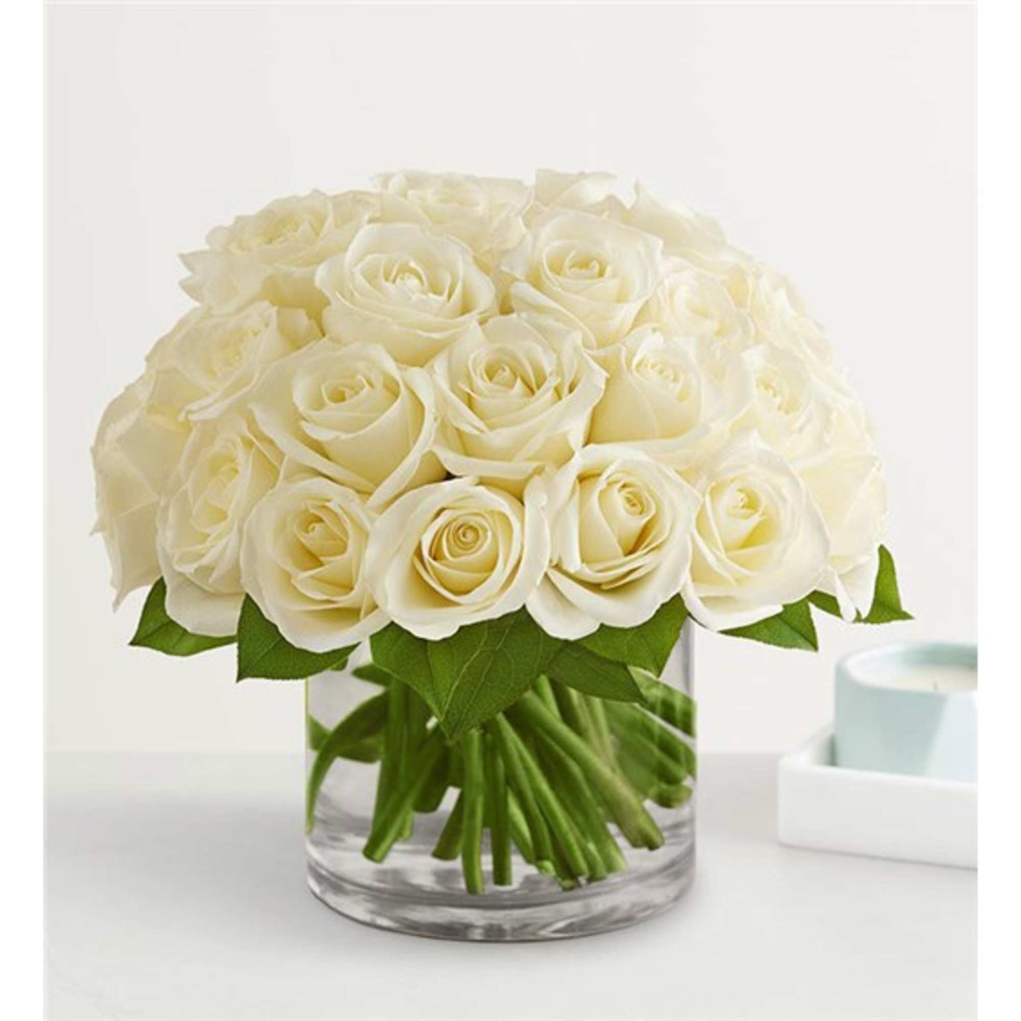 White rose bouquet in a clear glass vase