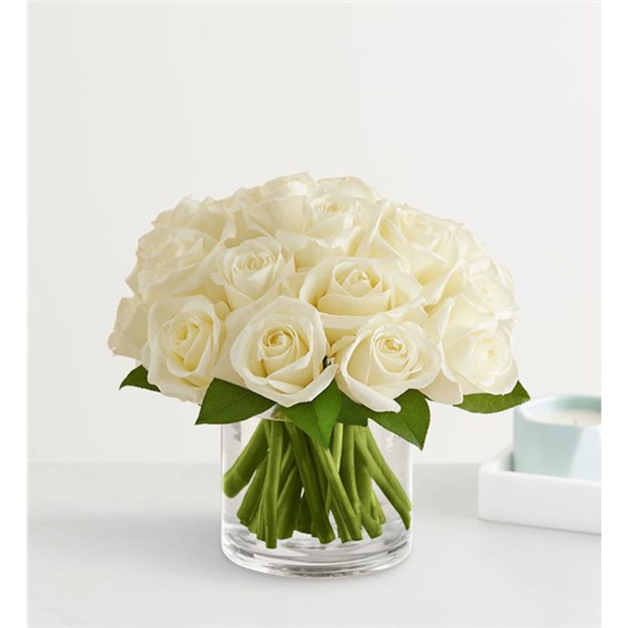 Bouquet of white roses in a clear glass vase