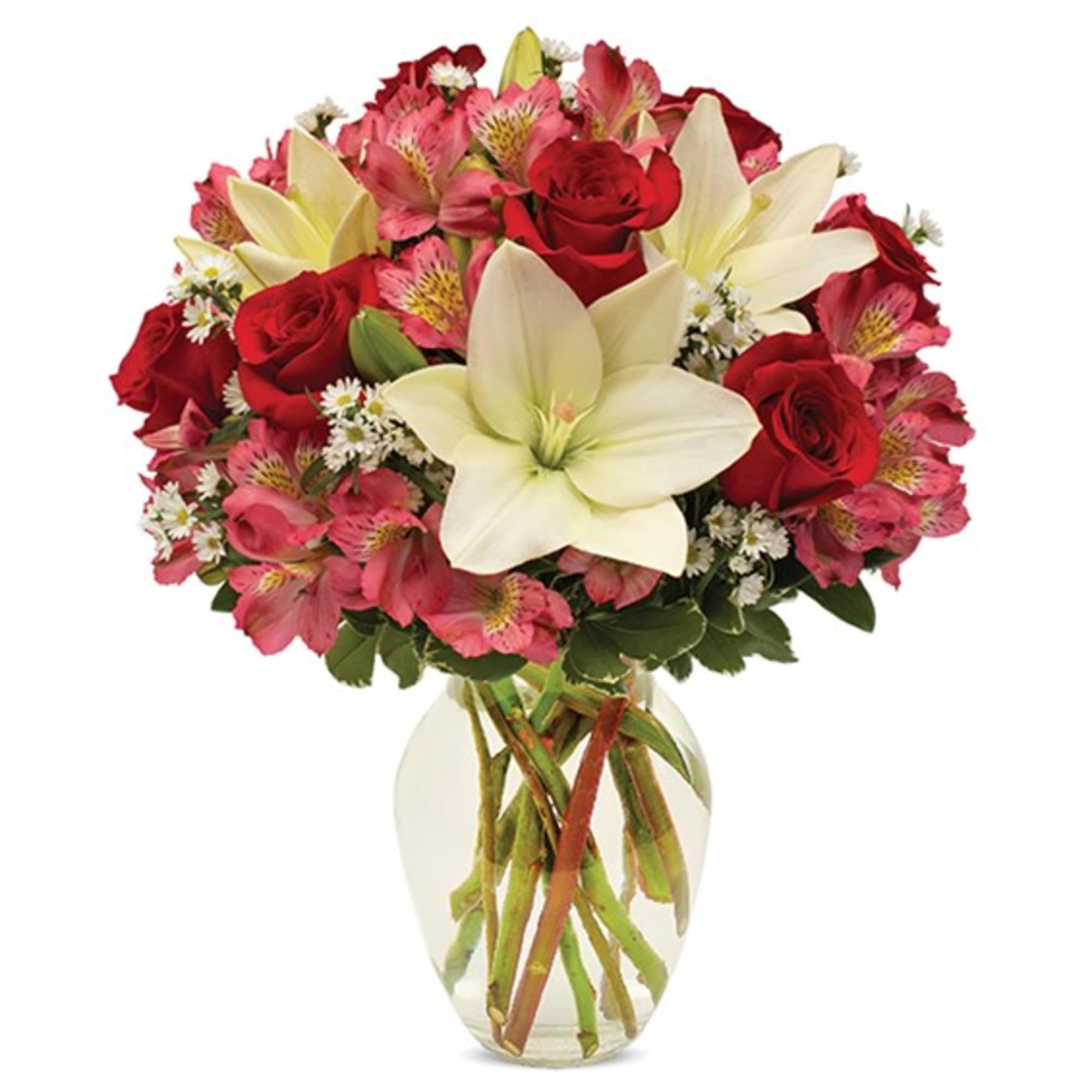 Bouquet of red roses, pink alstroemeria, and white lilies in a clear glass vase