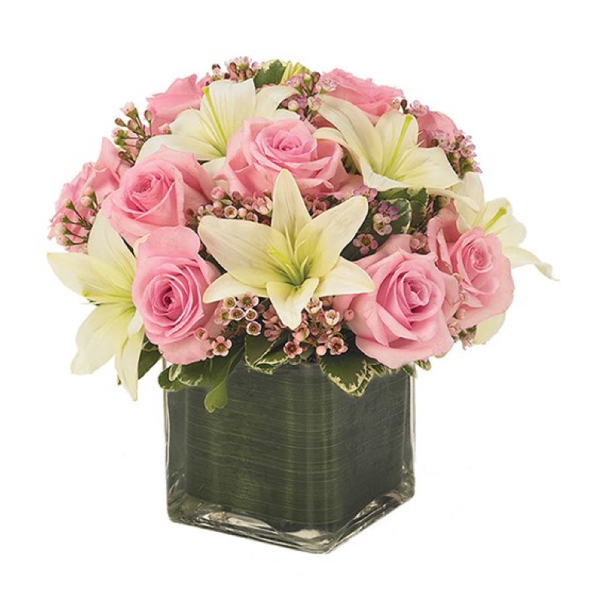 Pink roses and white lilies arranged in a square glass vase